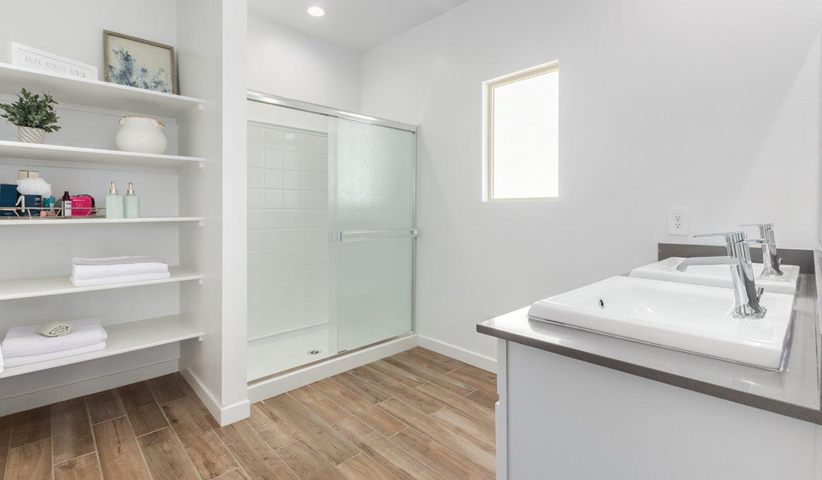 Step into The Kingston at Hanson Ridge in Vail Arizona – a perfect blend of comfort, modern living, and energy efficiency. This thoughtfully crafted single-story home spans 2,053 square feet and has four bedrooms and two bathrooms. This newly designed model offers harmony of comfort and desert elegance.  The open-concept design features a spacious great room that effortlessly connects with the kitchen and dining area, creating an inviting central hub for everyday living and entertaining. The kitchen is equipped with contemporary appliances and a pantry, offering ample storage and convenience for meal preparation and large center island. The primary bedroom, located at the rear of the home, provides a peaceful retreat with a private ensuite bathroom and a generous walk-in closet. The additional three bedrooms are positioned at the front of the house, offering versatility for use as guest rooms, a home office, or children’s bedrooms. Step outside to the covered patio, a perfect spot to enjoy the beautiful Arizona weather, whether for morning coffee or evening relaxation.  Built with energy efficiency as a priority, The Kingston includes smart home technology, which not only simplifies daily living but also helps reduce utility costs. A two-car garage provides ample parking and additional storage space, enhancing the home’s functionality. The Kingston at Hanson Ridge meets DOE Zero Energy Ready Home standards, ensuring sustainability and long-term savings.  Living at Hanson Ridge means more than just having a beautiful home. The community offers a peaceful lifestyle with incredible desert landscapes, mountain views, and easy access to I-10 for convenient commutes to Tucson and surrounding areas. Experience the charm and comfort of The Kingston at Hanson Ridge, where modern convenience meets the beauty of Arizona’s desert landscape.