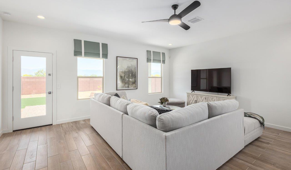 Step into The Kingston at Hanson Ridge in Vail Arizona – a perfect blend of comfort, modern living, and energy efficiency. This thoughtfully crafted single-story home spans 2,053 square feet and has four bedrooms and two bathrooms. This newly designed model offers harmony of comfort and desert elegance.  The open-concept design features a spacious great room that effortlessly connects with the kitchen and dining area, creating an inviting central hub for everyday living and entertaining. The kitchen is equipped with contemporary appliances and a pantry, offering ample storage and convenience for meal preparation and large center island. The primary bedroom, located at the rear of the home, provides a peaceful retreat with a private ensuite bathroom and a generous walk-in closet. The additional three bedrooms are positioned at the front of the house, offering versatility for use as guest rooms, a home office, or children’s bedrooms. Step outside to the covered patio, a perfect spot to enjoy the beautiful Arizona weather, whether for morning coffee or evening relaxation.  Built with energy efficiency as a priority, The Kingston includes smart home technology, which not only simplifies daily living but also helps reduce utility costs. A two-car garage provides ample parking and additional storage space, enhancing the home’s functionality. The Kingston at Hanson Ridge meets DOE Zero Energy Ready Home standards, ensuring sustainability and long-term savings.  Living at Hanson Ridge means more than just having a beautiful home. The community offers a peaceful lifestyle with incredible desert landscapes, mountain views, and easy access to I-10 for convenient commutes to Tucson and surrounding areas. Experience the charm and comfort of The Kingston at Hanson Ridge, where modern convenience meets the beauty of Arizona’s desert landscape.