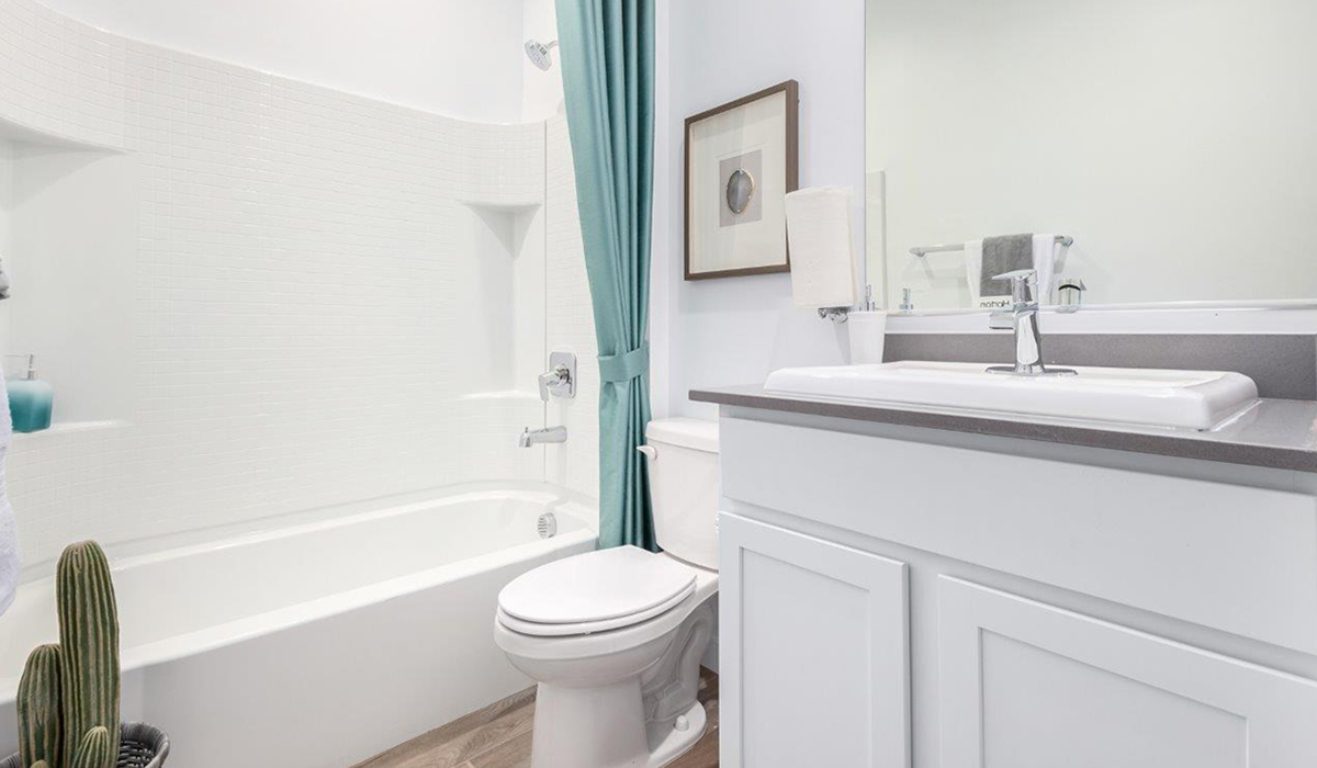 Step into The Kingston at Hanson Ridge in Vail Arizona – a perfect blend of comfort, modern living, and energy efficiency. This thoughtfully crafted single-story home spans 2,053 square feet and has four bedrooms and two bathrooms. This newly designed model offers harmony of comfort and desert elegance.  The open-concept design features a spacious great room that effortlessly connects with the kitchen and dining area, creating an inviting central hub for everyday living and entertaining. The kitchen is equipped with contemporary appliances and a pantry, offering ample storage and convenience for meal preparation and large center island. The primary bedroom, located at the rear of the home, provides a peaceful retreat with a private ensuite bathroom and a generous walk-in closet. The additional three bedrooms are positioned at the front of the house, offering versatility for use as guest rooms, a home office, or children’s bedrooms. Step outside to the covered patio, a perfect spot to enjoy the beautiful Arizona weather, whether for morning coffee or evening relaxation.  Built with energy efficiency as a priority, The Kingston includes smart home technology, which not only simplifies daily living but also helps reduce utility costs. A two-car garage provides ample parking and additional storage space, enhancing the home’s functionality. The Kingston at Hanson Ridge meets DOE Zero Energy Ready Home standards, ensuring sustainability and long-term savings.  Living at Hanson Ridge means more than just having a beautiful home. The community offers a peaceful lifestyle with incredible desert landscapes, mountain views, and easy access to I-10 for convenient commutes to Tucson and surrounding areas. Experience the charm and comfort of The Kingston at Hanson Ridge, where modern convenience meets the beauty of Arizona’s desert landscape.