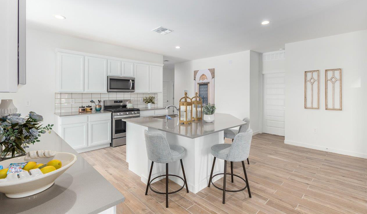 Step into The Kingston at Hanson Ridge in Vail Arizona – a perfect blend of comfort, modern living, and energy efficiency. This thoughtfully crafted single-story home spans 2,053 square feet and has four bedrooms and two bathrooms. This newly designed model offers harmony of comfort and desert elegance.  The open-concept design features a spacious great room that effortlessly connects with the kitchen and dining area, creating an inviting central hub for everyday living and entertaining. The kitchen is equipped with contemporary appliances and a pantry, offering ample storage and convenience for meal preparation and large center island. The primary bedroom, located at the rear of the home, provides a peaceful retreat with a private ensuite bathroom and a generous walk-in closet. The additional three bedrooms are positioned at the front of the house, offering versatility for use as guest rooms, a home office, or children’s bedrooms. Step outside to the covered patio, a perfect spot to enjoy the beautiful Arizona weather, whether for morning coffee or evening relaxation.  Built with energy efficiency as a priority, The Kingston includes smart home technology, which not only simplifies daily living but also helps reduce utility costs. A two-car garage provides ample parking and additional storage space, enhancing the home’s functionality. The Kingston at Hanson Ridge meets DOE Zero Energy Ready Home standards, ensuring sustainability and long-term savings.  Living at Hanson Ridge means more than just having a beautiful home. The community offers a peaceful lifestyle with incredible desert landscapes, mountain views, and easy access to I-10 for convenient commutes to Tucson and surrounding areas. Experience the charm and comfort of The Kingston at Hanson Ridge, where modern convenience meets the beauty of Arizona’s desert landscape.