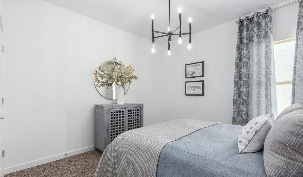 Step into The Kingston at Hanson Ridge in Vail Arizona – a perfect blend of comfort, modern living, and energy efficiency. This thoughtfully crafted single-story home spans 2,053 square feet and has four bedrooms and two bathrooms. This newly designed model offers harmony of comfort and desert elegance.  The open-concept design features a spacious great room that effortlessly connects with the kitchen and dining area, creating an inviting central hub for everyday living and entertaining. The kitchen is equipped with contemporary appliances and a pantry, offering ample storage and convenience for meal preparation and large center island. The primary bedroom, located at the rear of the home, provides a peaceful retreat with a private ensuite bathroom and a generous walk-in closet. The additional three bedrooms are positioned at the front of the house, offering versatility for use as guest rooms, a home office, or children’s bedrooms. Step outside to the covered patio, a perfect spot to enjoy the beautiful Arizona weather, whether for morning coffee or evening relaxation.  Built with energy efficiency as a priority, The Kingston includes smart home technology, which not only simplifies daily living but also helps reduce utility costs. A two-car garage provides ample parking and additional storage space, enhancing the home’s functionality. The Kingston at Hanson Ridge meets DOE Zero Energy Ready Home standards, ensuring sustainability and long-term savings.  Living at Hanson Ridge means more than just having a beautiful home. The community offers a peaceful lifestyle with incredible desert landscapes, mountain views, and easy access to I-10 for convenient commutes to Tucson and surrounding areas. Experience the charm and comfort of The Kingston at Hanson Ridge, where modern convenience meets the beauty of Arizona’s desert landscape.