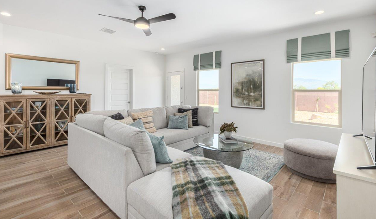 Step into The Kingston at Hanson Ridge in Vail Arizona – a perfect blend of comfort, modern living, and energy efficiency. This thoughtfully crafted single-story home spans 2,053 square feet and has four bedrooms and two bathrooms. This newly designed model offers harmony of comfort and desert elegance.  The open-concept design features a spacious great room that effortlessly connects with the kitchen and dining area, creating an inviting central hub for everyday living and entertaining. The kitchen is equipped with contemporary appliances and a pantry, offering ample storage and convenience for meal preparation and large center island. The primary bedroom, located at the rear of the home, provides a peaceful retreat with a private ensuite bathroom and a generous walk-in closet. The additional three bedrooms are positioned at the front of the house, offering versatility for use as guest rooms, a home office, or children’s bedrooms. Step outside to the covered patio, a perfect spot to enjoy the beautiful Arizona weather, whether for morning coffee or evening relaxation.  Built with energy efficiency as a priority, The Kingston includes smart home technology, which not only simplifies daily living but also helps reduce utility costs. A two-car garage provides ample parking and additional storage space, enhancing the home’s functionality. The Kingston at Hanson Ridge meets DOE Zero Energy Ready Home standards, ensuring sustainability and long-term savings.  Living at Hanson Ridge means more than just having a beautiful home. The community offers a peaceful lifestyle with incredible desert landscapes, mountain views, and easy access to I-10 for convenient commutes to Tucson and surrounding areas. Experience the charm and comfort of The Kingston at Hanson Ridge, where modern convenience meets the beauty of Arizona’s desert landscape.