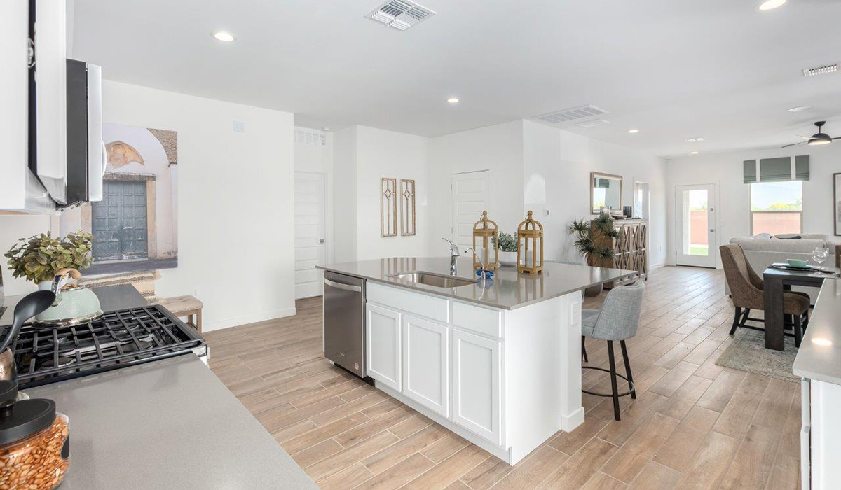 Step into The Kingston at Hanson Ridge in Vail Arizona – a perfect blend of comfort, modern living, and energy efficiency. This thoughtfully crafted single-story home spans 2,053 square feet and has four bedrooms and two bathrooms. This newly designed model offers harmony of comfort and desert elegance.  The open-concept design features a spacious great room that effortlessly connects with the kitchen and dining area, creating an inviting central hub for everyday living and entertaining. The kitchen is equipped with contemporary appliances and a pantry, offering ample storage and convenience for meal preparation and large center island. The primary bedroom, located at the rear of the home, provides a peaceful retreat with a private ensuite bathroom and a generous walk-in closet. The additional three bedrooms are positioned at the front of the house, offering versatility for use as guest rooms, a home office, or children’s bedrooms. Step outside to the covered patio, a perfect spot to enjoy the beautiful Arizona weather, whether for morning coffee or evening relaxation.  Built with energy efficiency as a priority, The Kingston includes smart home technology, which not only simplifies daily living but also helps reduce utility costs. A two-car garage provides ample parking and additional storage space, enhancing the home’s functionality. The Kingston at Hanson Ridge meets DOE Zero Energy Ready Home standards, ensuring sustainability and long-term savings.  Living at Hanson Ridge means more than just having a beautiful home. The community offers a peaceful lifestyle with incredible desert landscapes, mountain views, and easy access to I-10 for convenient commutes to Tucson and surrounding areas. Experience the charm and comfort of The Kingston at Hanson Ridge, where modern convenience meets the beauty of Arizona’s desert landscape.