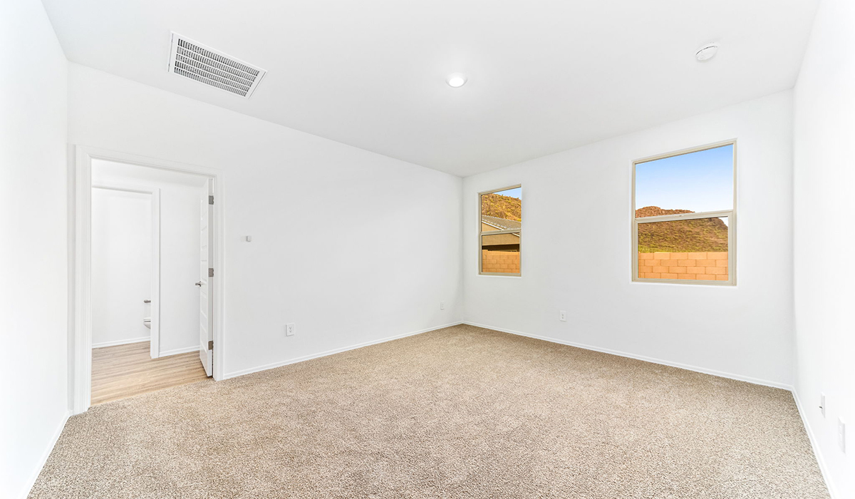 Discover the Dalea at Hanson Ridge in Vail, Arizona - a beautifully designed single-story home that perfectly balances comfort and elegance. This thoughtfully crafted floor plan offers two spacious layout options: a 2,058 sq. ft. home featuring four bedrooms and a 3-car tandem garage, or a 2,224 sq. ft. layout with five bedrooms and a two-car garage. Whether you're looking for extra space or a more open layout, the Dalea is designed to suit your lifestyle with style and functionality in every detail.  As you enter through the inviting front porch, you're welcomed into a bright and airy living space that flows seamlessly into the great room, dining area, and kitchen. This open-concept design is perfect for both family gatherings and entertaining. The kitchen features Quartz countertops, Shaker Style Cabinetry, modern appliances, and a convenient pantry, making meal preparation a breeze.  The primary suite, located at the rear of the home, providing a private retreat with a spacious a large walk-in closet, and en-suite bathroom featuring dual vanities and a walk-in shower. This suite offers a peaceful escape, ideal for relaxation. This thoughtfully designed four to five-bedroom home offers privacy and comfort with three bathrooms. The Dalea plan also includes a utility room and two-car garage with the option of three-car garage.   Living at Hanson Ridge means more than just having a beautiful home. The community offers a peaceful lifestyle with incredible desert landscapes, mountain views, and easy access to I-10 for convenient commutes to Tucson and surrounding areas. Designed with energy efficiency in mind, The Dalea at Hanson Ridge meets Zero Energy Ready Home standards, ensuring sustainability and long-term savings.  Experience the charm and comfort of The Dalea at Hanson Ridge, where modern convenience meets the beauty of Arizona’s desert landscape.