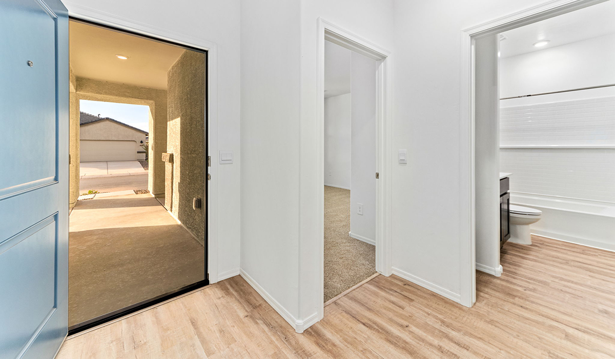 Discover the Dalea at Hanson Ridge in Vail, Arizona - a beautifully designed single-story home that perfectly balances comfort and elegance. This thoughtfully crafted floor plan offers two spacious layout options: a 2,058 sq. ft. home featuring four bedrooms and a 3-car tandem garage, or a 2,224 sq. ft. layout with five bedrooms and a two-car garage. Whether you're looking for extra space or a more open layout, the Dalea is designed to suit your lifestyle with style and functionality in every detail.  As you enter through the inviting front porch, you're welcomed into a bright and airy living space that flows seamlessly into the great room, dining area, and kitchen. This open-concept design is perfect for both family gatherings and entertaining. The kitchen features Quartz countertops, Shaker Style Cabinetry, modern appliances, and a convenient pantry, making meal preparation a breeze.  The primary suite, located at the rear of the home, providing a private retreat with a spacious a large walk-in closet, and en-suite bathroom featuring dual vanities and a walk-in shower. This suite offers a peaceful escape, ideal for relaxation. This thoughtfully designed four to five-bedroom home offers privacy and comfort with three bathrooms. The Dalea plan also includes a utility room and two-car garage with the option of three-car garage.   Living at Hanson Ridge means more than just having a beautiful home. The community offers a peaceful lifestyle with incredible desert landscapes, mountain views, and easy access to I-10 for convenient commutes to Tucson and surrounding areas. Designed with energy efficiency in mind, The Dalea at Hanson Ridge meets Zero Energy Ready Home standards, ensuring sustainability and long-term savings.  Experience the charm and comfort of The Dalea at Hanson Ridge, where modern convenience meets the beauty of Arizona’s desert landscape.