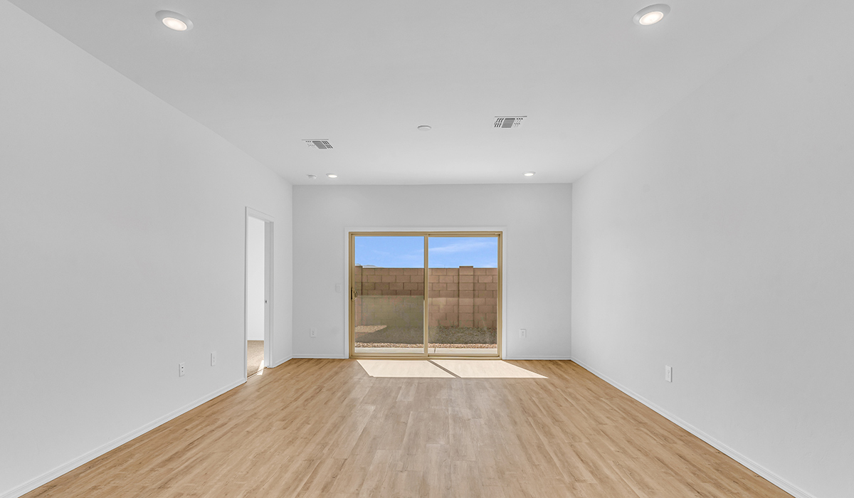 Welcome to The Amber at Hanson Ridge in Vail, Arizona – a beautifully crafted 1,331 sq. ft. single-story new home that offers modern living in a peaceful desert setting.  As you step through the inviting front porch, the thoughtfully designed entryway leads you into an open-concept living space that seamlessly connects the great room, dining area, and kitchen. This layout is ideal for both relaxing with family and entertaining guests. The kitchen, equipped with granite countertops, modern appliances, and a convenient pantry, is designed to meet your culinary needs while maintaining a stylish appeal.  The master suite, located at the rear of the home, offers a private retreat. The spacious bedroom is complemented by a large walk-in closet and an en-suite bathroom featuring dual vanities and a walk-in shower. This suite provides a serene space to unwind after a day of exploring the nearby Rincon Mountains or hiking through Saguaro National Park.  Two additional bedrooms are thoughtfully positioned to offer comfort and privacy, sharing a well-appointed full bathroom. The home also includes a utility room and direct access to a two-car garage, ensuring daily tasks are convenient and efficient.  Step outside to the covered patio, where you can enjoy Arizona’s beautiful weather and the incredible desert landscapes that Hanson Ridge has to offer. Whether you're enjoying a quiet morning coffee or hosting an evening gathering, this outdoor space is the perfect extension of your living area.  Living at Hanson Ridge means more than just having a beautiful home. The community offers a serene lifestyle with incredible mountain views and easy access to I-10 for convenient commutes to Tucson and surrounding areas. Hanson Ridge is designed with energy efficiency in mind, meeting DOE Zero Energy Ready Home standards to provide both comfort and sustainability.   Explore the charm and comfort of Hanson Ridge, where your new home awaits.