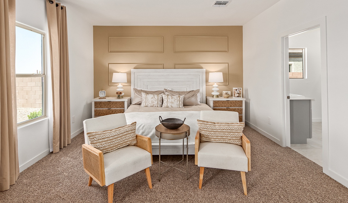 Step into The Kingston at Barnett Village, Marana, Arizona – a perfect blend of comfort, modern living, and energy efficiency. This thoughtfully crafted one-story home spans 2,068 square feet and offers four bedrooms and two bathrooms, ideal for families of all sizes.  The open-concept design features a spacious great room that effortlessly connects with the kitchen and dining area, creating an inviting central hub for everyday living and entertaining. The kitchen is equipped with contemporary appliances and a pantry, offering ample storage and convenience for meal preparation.  The primary bedroom, located at the rear of the home, provides a peaceful retreat with a private ensuite bathroom and a generous walk-in closet. The additional three bedrooms are positioned at the front of the house, offering versatility for use as guest rooms, a home office, or children’s bedrooms. Step outside to the covered patio, a perfect spot to enjoy the beautiful Arizona weather, whether for morning coffee or evening relaxation.  The Kingston also boasts a covered patio, perfect for enjoying Arizona’s beautiful desert evenings. Whether it’s morning coffee or evening relaxation, this outdoor space extends your living area into the serene landscape of Barnett Village.  Built with energy efficiency as a priority, the Kingston includes smart home technology, which not only simplifies daily living but also helps reduce utility costs. A two-car garage provides ample parking and additional storage space, enhancing the home’s functionality.