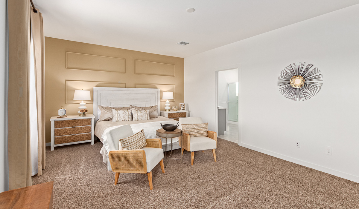 Step into The Kingston at Barnett Village, Marana, Arizona – a perfect blend of comfort, modern living, and energy efficiency. This thoughtfully crafted one-story home spans 2,068 square feet and offers four bedrooms and two bathrooms, ideal for families of all sizes.  The open-concept design features a spacious great room that effortlessly connects with the kitchen and dining area, creating an inviting central hub for everyday living and entertaining. The kitchen is equipped with contemporary appliances and a pantry, offering ample storage and convenience for meal preparation.  The primary bedroom, located at the rear of the home, provides a peaceful retreat with a private ensuite bathroom and a generous walk-in closet. The additional three bedrooms are positioned at the front of the house, offering versatility for use as guest rooms, a home office, or children’s bedrooms. Step outside to the covered patio, a perfect spot to enjoy the beautiful Arizona weather, whether for morning coffee or evening relaxation.  The Kingston also boasts a covered patio, perfect for enjoying Arizona’s beautiful desert evenings. Whether it’s morning coffee or evening relaxation, this outdoor space extends your living area into the serene landscape of Barnett Village.  Built with energy efficiency as a priority, the Kingston includes smart home technology, which not only simplifies daily living but also helps reduce utility costs. A two-car garage provides ample parking and additional storage space, enhancing the home’s functionality.