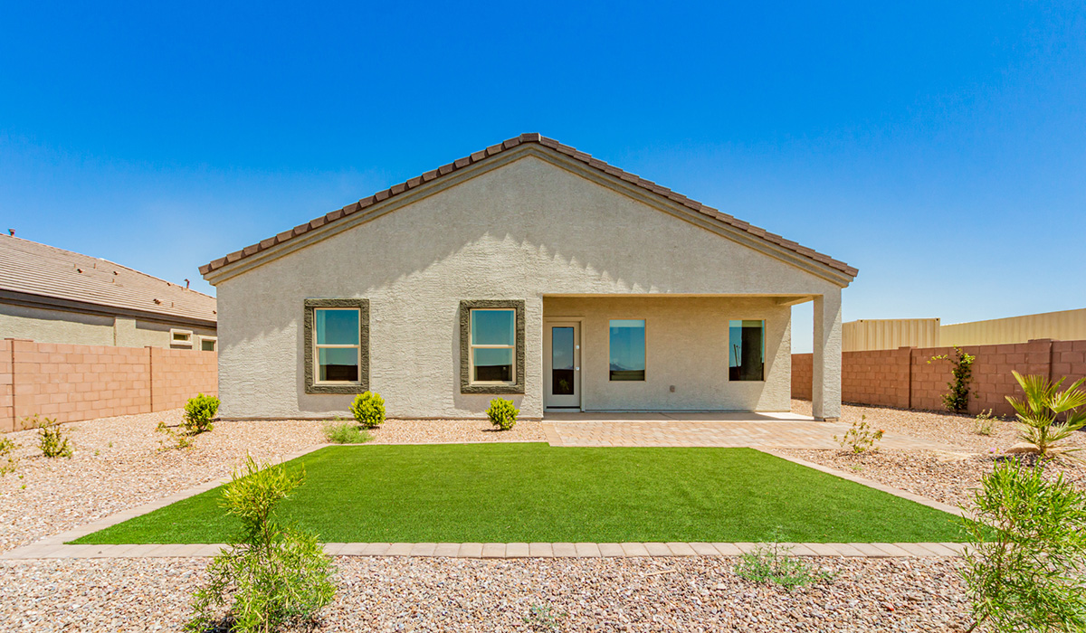 Step into The Kingston at Barnett Village, Marana, Arizona – a perfect blend of comfort, modern living, and energy efficiency. This thoughtfully crafted one-story home spans 2,068 square feet and offers four bedrooms and two bathrooms, ideal for families of all sizes.  The open-concept design features a spacious great room that effortlessly connects with the kitchen and dining area, creating an inviting central hub for everyday living and entertaining. The kitchen is equipped with contemporary appliances and a pantry, offering ample storage and convenience for meal preparation.  The primary bedroom, located at the rear of the home, provides a peaceful retreat with a private ensuite bathroom and a generous walk-in closet. The additional three bedrooms are positioned at the front of the house, offering versatility for use as guest rooms, a home office, or children’s bedrooms. Step outside to the covered patio, a perfect spot to enjoy the beautiful Arizona weather, whether for morning coffee or evening relaxation.  The Kingston also boasts a covered patio, perfect for enjoying Arizona’s beautiful desert evenings. Whether it’s morning coffee or evening relaxation, this outdoor space extends your living area into the serene landscape of Barnett Village.  Built with energy efficiency as a priority, the Kingston includes smart home technology, which not only simplifies daily living but also helps reduce utility costs. A two-car garage provides ample parking and additional storage space, enhancing the home’s functionality.