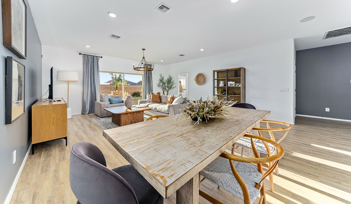 Step into The Kingston at Barnett Village, Marana, Arizona – a perfect blend of comfort, modern living, and energy efficiency. This thoughtfully crafted one-story home spans 2,068 square feet and offers four bedrooms and two bathrooms, ideal for families of all sizes.  The open-concept design features a spacious great room that effortlessly connects with the kitchen and dining area, creating an inviting central hub for everyday living and entertaining. The kitchen is equipped with contemporary appliances and a pantry, offering ample storage and convenience for meal preparation.  The primary bedroom, located at the rear of the home, provides a peaceful retreat with a private ensuite bathroom and a generous walk-in closet. The additional three bedrooms are positioned at the front of the house, offering versatility for use as guest rooms, a home office, or children’s bedrooms. Step outside to the covered patio, a perfect spot to enjoy the beautiful Arizona weather, whether for morning coffee or evening relaxation.  The Kingston also boasts a covered patio, perfect for enjoying Arizona’s beautiful desert evenings. Whether it’s morning coffee or evening relaxation, this outdoor space extends your living area into the serene landscape of Barnett Village.  Built with energy efficiency as a priority, the Kingston includes smart home technology, which not only simplifies daily living but also helps reduce utility costs. A two-car garage provides ample parking and additional storage space, enhancing the home’s functionality.  Images shown are for reference only. They depict the sales model home and may not represent the actual home.