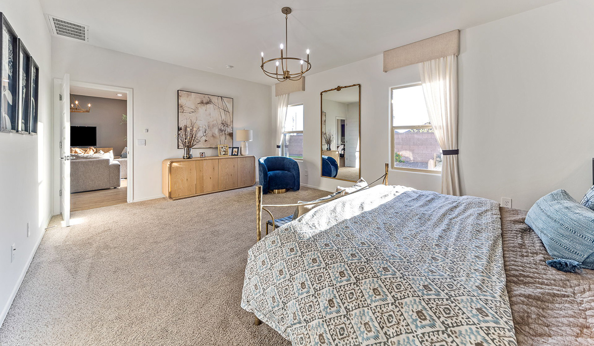 Step into The Kingston at Barnett Village, Marana, Arizona – a perfect blend of comfort, modern living, and energy efficiency. This thoughtfully crafted one-story home spans 2,068 square feet and offers four bedrooms and two bathrooms, ideal for families of all sizes.  The open-concept design features a spacious great room that effortlessly connects with the kitchen and dining area, creating an inviting central hub for everyday living and entertaining. The kitchen is equipped with contemporary appliances and a pantry, offering ample storage and convenience for meal preparation.  The primary bedroom, located at the rear of the home, provides a peaceful retreat with a private ensuite bathroom and a generous walk-in closet. The additional three bedrooms are positioned at the front of the house, offering versatility for use as guest rooms, a home office, or children’s bedrooms. Step outside to the covered patio, a perfect spot to enjoy the beautiful Arizona weather, whether for morning coffee or evening relaxation.  The Kingston also boasts a covered patio, perfect for enjoying Arizona’s beautiful desert evenings. Whether it’s morning coffee or evening relaxation, this outdoor space extends your living area into the serene landscape of Barnett Village.  Built with energy efficiency as a priority, the Kingston includes smart home technology, which not only simplifies daily living but also helps reduce utility costs. A two-car garage provides ample parking and additional storage space, enhancing the home’s functionality.  Images shown are for reference only. They depict the sales model home and may not represent the actual home.