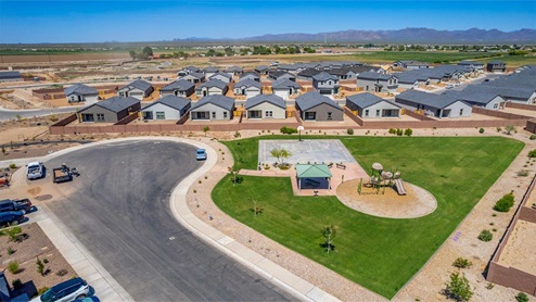 Welcome to Barnett Village, a vibrant new home community nestled in the growing town of Marana, Arizona, just northwest of Tucson. Located off Tangerine Road, this community offers a serene desert lifestyle with modern conveniences. Choose from a variety of thoughtfully designed single-family homes that feature up to five bedrooms, spacious open-concept living areas, and energy-efficient features, including DOE Zero Energy Ready Home certification, ensuring both sustainability and savings. Barnett Village stands out with its range of family-friendly amenities, including a playground, a half basketball court, ramadas, BBQ areas, and extensive walking trails. Enjoy the lush green spaces and gather with friends and family in beautifully landscaped parks. The community is just a short drive from major outdoor attractions such as Catalina State Park, Picacho Peak State Park, and Saguaro National Park, offering endless opportunities for hiking, cycling, and wildlife viewing. Residents of Barnett Village benefit from its proximity to excellent schools in the Marana Unified School District and easy access to shopping, dining, and recreation. The upcoming community pool in Marana, along with nearby attractions like the Marana Pumpkin Patch, Tucson Premium Outlets, and Heritage River Park, further enhance the lifestyle offered here. The homes at Barnett Village are designed with comfort and convenience in mind, featuring granite countertops, spacious walk-in closets, dual vanities in master baths, and smart home technology. With its blend of modern amenities, scenic beauty, and convenient location, Barnett Village is the perfect place to call home. Explore Barnett Village today and discover a community where you can truly thrive.