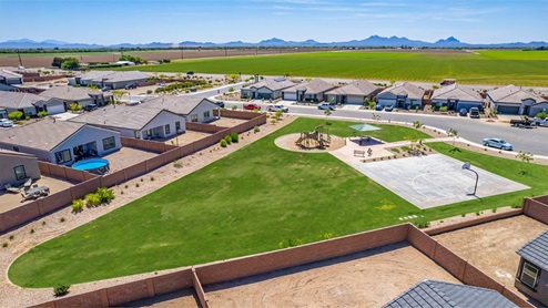 Welcome to Barnett Village, a vibrant new home community nestled in the growing town of Marana, Arizona, just northwest of Tucson. Located off Tangerine Road, this community offers a serene desert lifestyle with modern conveniences. Choose from a variety of thoughtfully designed single-family homes that feature up to five bedrooms, spacious open-concept living areas, and energy-efficient features, including DOE Zero Energy Ready Home certification, ensuring both sustainability and savings. Barnett Village stands out with its range of family-friendly amenities, including a playground, a half basketball court, ramadas, BBQ areas, and extensive walking trails. Enjoy the lush green spaces and gather with friends and family in beautifully landscaped parks. The community is just a short drive from major outdoor attractions such as Catalina State Park, Picacho Peak State Park, and Saguaro National Park, offering endless opportunities for hiking, cycling, and wildlife viewing. Residents of Barnett Village benefit from its proximity to excellent schools in the Marana Unified School District and easy access to shopping, dining, and recreation. The upcoming community pool in Marana, along with nearby attractions like the Marana Pumpkin Patch, Tucson Premium Outlets, and Heritage River Park, further enhance the lifestyle offered here. The homes at Barnett Village are designed with comfort and convenience in mind, featuring granite countertops, spacious walk-in closets, dual vanities in master baths, and smart home technology. With its blend of modern amenities, scenic beauty, and convenient location, Barnett Village is the perfect place to call home. Explore Barnett Village today and discover a community where you can truly thrive.