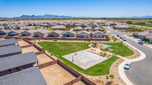 Welcome to Barnett Village, a vibrant new home community nestled in the growing town of Marana, Arizona, just northwest of Tucson. Located off Tangerine Road, this community offers a serene desert lifestyle with modern conveniences. Choose from a variety of thoughtfully designed single-family homes that feature up to five bedrooms, spacious open-concept living areas, and energy-efficient features, including DOE Zero Energy Ready Home certification, ensuring both sustainability and savings. Barnett Village stands out with its range of family-friendly amenities, including a playground, a half basketball court, ramadas, BBQ areas, and extensive walking trails. Enjoy the lush green spaces and gather with friends and family in beautifully landscaped parks. The community is just a short drive from major outdoor attractions such as Catalina State Park, Picacho Peak State Park, and Saguaro National Park, offering endless opportunities for hiking, cycling, and wildlife viewing. Residents of Barnett Village benefit from its proximity to excellent schools in the Marana Unified School District and easy access to shopping, dining, and recreation. The upcoming community pool in Marana, along with nearby attractions like the Marana Pumpkin Patch, Tucson Premium Outlets, and Heritage River Park, further enhance the lifestyle offered here. The homes at Barnett Village are designed with comfort and convenience in mind, featuring granite countertops, spacious walk-in closets, dual vanities in master baths, and smart home technology. With its blend of modern amenities, scenic beauty, and convenient location, Barnett Village is the perfect place to call home. Explore Barnett Village today and discover a community where you can truly thrive.