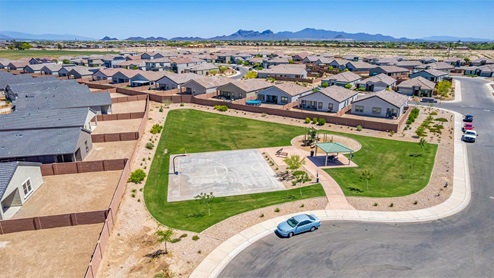 Welcome to Barnett Village, a vibrant new home community nestled in the growing town of Marana, Arizona, just northwest of Tucson. Located off Tangerine Road, this community offers a serene desert lifestyle with modern conveniences. Choose from a variety of thoughtfully designed single-family homes that feature up to five bedrooms, spacious open-concept living areas, and energy-efficient features, including DOE Zero Energy Ready Home certification, ensuring both sustainability and savings. Barnett Village stands out with its range of family-friendly amenities, including a playground, a half basketball court, ramadas, BBQ areas, and extensive walking trails. Enjoy the lush green spaces and gather with friends and family in beautifully landscaped parks. The community is just a short drive from major outdoor attractions such as Catalina State Park, Picacho Peak State Park, and Saguaro National Park, offering endless opportunities for hiking, cycling, and wildlife viewing. Residents of Barnett Village benefit from its proximity to excellent schools in the Marana Unified School District and easy access to shopping, dining, and recreation. The upcoming community pool in Marana, along with nearby attractions like the Marana Pumpkin Patch, Tucson Premium Outlets, and Heritage River Park, further enhance the lifestyle offered here. The homes at Barnett Village are designed with comfort and convenience in mind, featuring granite countertops, spacious walk-in closets, dual vanities in master baths, and smart home technology. With its blend of modern amenities, scenic beauty, and convenient location, Barnett Village is the perfect place to call home. Explore Barnett Village today and discover a community where you can truly thrive.