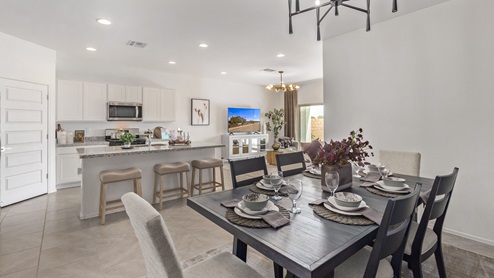 Welcome to Barnett Village, a vibrant new home community nestled in the growing town of Marana, Arizona, just northwest of Tucson. Located off Tangerine Road, this community offers a serene desert lifestyle with modern conveniences. Choose from a variety of thoughtfully designed single-family homes that feature up to five bedrooms, spacious open-concept living areas, and energy-efficient features, including DOE Zero Energy Ready Home certification, ensuring both sustainability and savings. Barnett Village stands out with its range of family-friendly amenities, including a playground, a half basketball court, ramadas, BBQ areas, and extensive walking trails. Enjoy the lush green spaces and gather with friends and family in beautifully landscaped parks. The community is just a short drive from major outdoor attractions such as Catalina State Park, Picacho Peak State Park, and Saguaro National Park, offering endless opportunities for hiking, cycling, and wildlife viewing. Residents of Barnett Village benefit from its proximity to excellent schools in the Marana Unified School District and easy access to shopping, dining, and recreation. The upcoming community pool in Marana, along with nearby attractions like the Marana Pumpkin Patch, Tucson Premium Outlets, and Heritage River Park, further enhance the lifestyle offered here. The homes at Barnett Village are designed with comfort and convenience in mind, featuring granite countertops, spacious walk-in closets, dual vanities in master baths, and smart home technology. With its blend of modern amenities, scenic beauty, and convenient location, Barnett Village is the perfect place to call home. Explore Barnett Village today and discover a community where you can truly thrive.
