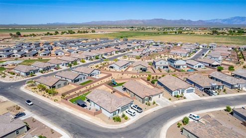 Welcome to Barnett Village, a vibrant new home community nestled in the growing town of Marana, Arizona, just northwest of Tucson. Located off Tangerine Road, this community offers a serene desert lifestyle with modern conveniences. Choose from a variety of thoughtfully designed single-family homes that feature up to five bedrooms, spacious open-concept living areas, and energy-efficient features, including DOE Zero Energy Ready Home certification, ensuring both sustainability and savings. Barnett Village stands out with its range of family-friendly amenities, including a playground, a half basketball court, ramadas, BBQ areas, and extensive walking trails. Enjoy the lush green spaces and gather with friends and family in beautifully landscaped parks. The community is just a short drive from major outdoor attractions such as Catalina State Park, Picacho Peak State Park, and Saguaro National Park, offering endless opportunities for hiking, cycling, and wildlife viewing. Residents of Barnett Village benefit from its proximity to excellent schools in the Marana Unified School District and easy access to shopping, dining, and recreation. The upcoming community pool in Marana, along with nearby attractions like the Marana Pumpkin Patch, Tucson Premium Outlets, and Heritage River Park, further enhance the lifestyle offered here. The homes at Barnett Village are designed with comfort and convenience in mind, featuring granite countertops, spacious walk-in closets, dual vanities in master baths, and smart home technology. With its blend of modern amenities, scenic beauty, and convenient location, Barnett Village is the perfect place to call home. Explore Barnett Village today and discover a community where you can truly thrive.