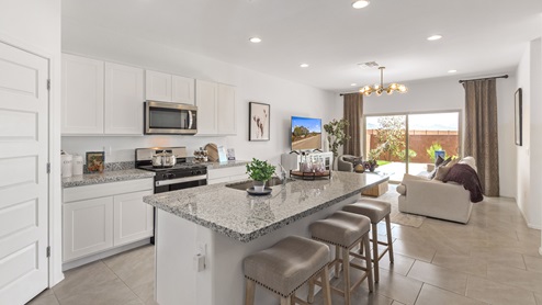 Welcome to Barnett Village, a vibrant new home community nestled in the growing town of Marana, Arizona, just northwest of Tucson. Located off Tangerine Road, this community offers a serene desert lifestyle with modern conveniences. Choose from a variety of thoughtfully designed single-family homes that feature up to five bedrooms, spacious open-concept living areas, and energy-efficient features, including DOE Zero Energy Ready Home certification, ensuring both sustainability and savings. Barnett Village stands out with its range of family-friendly amenities, including a playground, a half basketball court, ramadas, BBQ areas, and extensive walking trails. Enjoy the lush green spaces and gather with friends and family in beautifully landscaped parks. The community is just a short drive from major outdoor attractions such as Catalina State Park, Picacho Peak State Park, and Saguaro National Park, offering endless opportunities for hiking, cycling, and wildlife viewing. Residents of Barnett Village benefit from its proximity to excellent schools in the Marana Unified School District and easy access to shopping, dining, and recreation. The upcoming community pool in Marana, along with nearby attractions like the Marana Pumpkin Patch, Tucson Premium Outlets, and Heritage River Park, further enhance the lifestyle offered here. The homes at Barnett Village are designed with comfort and convenience in mind, featuring granite countertops, spacious walk-in closets, dual vanities in master baths, and smart home technology. With its blend of modern amenities, scenic beauty, and convenient location, Barnett Village is the perfect place to call home. Explore Barnett Village today and discover a community where you can truly thrive.