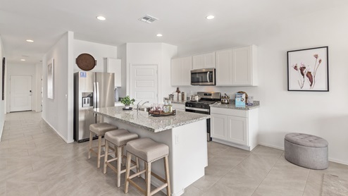 Welcome to Barnett Village, a vibrant new home community nestled in the growing town of Marana, Arizona, just northwest of Tucson. Located off Tangerine Road, this community offers a serene desert lifestyle with modern conveniences. Choose from a variety of thoughtfully designed single-family homes that feature up to five bedrooms, spacious open-concept living areas, and energy-efficient features, including DOE Zero Energy Ready Home certification, ensuring both sustainability and savings. Barnett Village stands out with its range of family-friendly amenities, including a playground, a half basketball court, ramadas, BBQ areas, and extensive walking trails. Enjoy the lush green spaces and gather with friends and family in beautifully landscaped parks. The community is just a short drive from major outdoor attractions such as Catalina State Park, Picacho Peak State Park, and Saguaro National Park, offering endless opportunities for hiking, cycling, and wildlife viewing. Residents of Barnett Village benefit from its proximity to excellent schools in the Marana Unified School District and easy access to shopping, dining, and recreation. The upcoming community pool in Marana, along with nearby attractions like the Marana Pumpkin Patch, Tucson Premium Outlets, and Heritage River Park, further enhance the lifestyle offered here. The homes at Barnett Village are designed with comfort and convenience in mind, featuring granite countertops, spacious walk-in closets, dual vanities in master baths, and smart home technology. With its blend of modern amenities, scenic beauty, and convenient location, Barnett Village is the perfect place to call home. Explore Barnett Village today and discover a community where you can truly thrive.