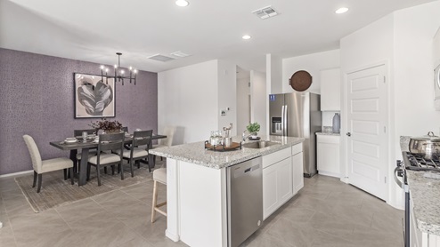 Welcome to Barnett Village, a vibrant new home community nestled in the growing town of Marana, Arizona, just northwest of Tucson. Located off Tangerine Road, this community offers a serene desert lifestyle with modern conveniences. Choose from a variety of thoughtfully designed single-family homes that feature up to five bedrooms, spacious open-concept living areas, and energy-efficient features, including DOE Zero Energy Ready Home certification, ensuring both sustainability and savings. Barnett Village stands out with its range of family-friendly amenities, including a playground, a half basketball court, ramadas, BBQ areas, and extensive walking trails. Enjoy the lush green spaces and gather with friends and family in beautifully landscaped parks. The community is just a short drive from major outdoor attractions such as Catalina State Park, Picacho Peak State Park, and Saguaro National Park, offering endless opportunities for hiking, cycling, and wildlife viewing. Residents of Barnett Village benefit from its proximity to excellent schools in the Marana Unified School District and easy access to shopping, dining, and recreation. The upcoming community pool in Marana, along with nearby attractions like the Marana Pumpkin Patch, Tucson Premium Outlets, and Heritage River Park, further enhance the lifestyle offered here. The homes at Barnett Village are designed with comfort and convenience in mind, featuring granite countertops, spacious walk-in closets, dual vanities in master baths, and smart home technology. With its blend of modern amenities, scenic beauty, and convenient location, Barnett Village is the perfect place to call home. Explore Barnett Village today and discover a community where you can truly thrive.