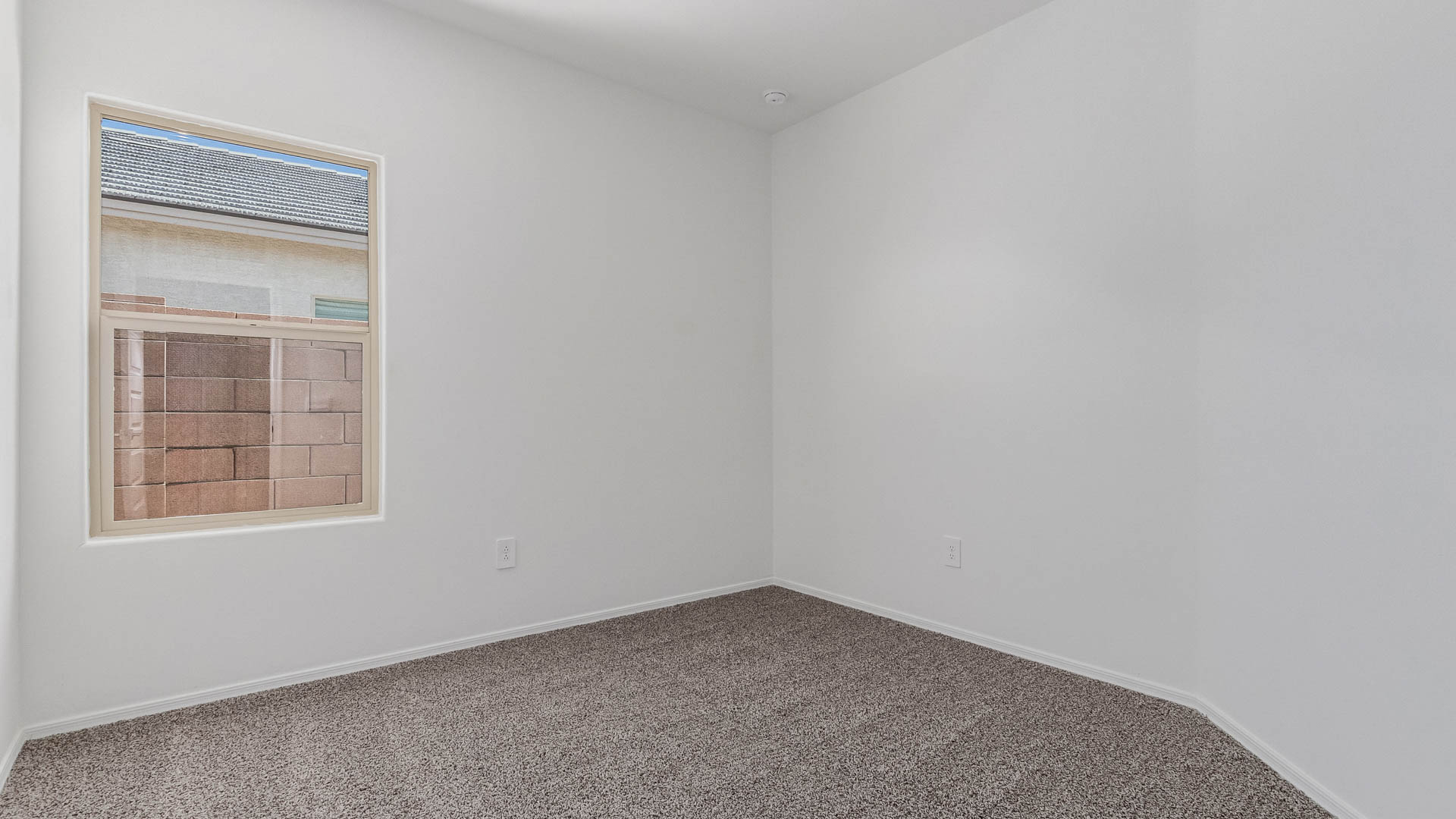 Welcome to The Parker at Barnett Village in Marana, Arizona – a stunning 1,909 sq. ft. single-story new home that combines space, comfort, and modern design for today’s growing families.  As you step through the inviting front porch and into the entryway, you’re immediately greeted by a well-thought-out floorplan that offers ample space for everyone. Just off the entry, Bedroom 5 is ideally situated for guests or as a private home office, complete with easy access to a full bathroom.  Moving further into the home, the spacious great room serves as the heart of The Parker. This open-concept area connects seamlessly to the dining room and kitchen, creating a perfect setting for both family gatherings and everyday living. The kitchen is a chef’s delight, featuring sleek granite countertops, modern appliances, a large island with a breakfast bar, and a walk-in pantry that ensures plenty of storage space.  Down a private hallway, you’ll discover the luxurious master suite. This spacious bedroom offers a serene retreat within the home, complete with a large walk-in closet and an en-suite bathroom featuring dual vanities and a walk-in shower. Three additional bedrooms are located nearby, sharing access to a full bathroom, making it easy to accommodate family and guests alike.  The Parker also includes a utility room conveniently located near the bedrooms, and a two-car garage that offers both storage and functionality.  Step outside from the great room to the covered patio – an ideal spot for enjoying Arizona’s beautiful weather year-round. Whether you’re hosting a barbecue or simply relaxing with a book, this outdoor space extends your living area into the serene surroundings of Barnett Village.  Designed with energy efficiency in mind, The Parker at Barnett Village is DOE Zero Energy Ready Home certified, ensuring a sustainable and cost-effective living environment.