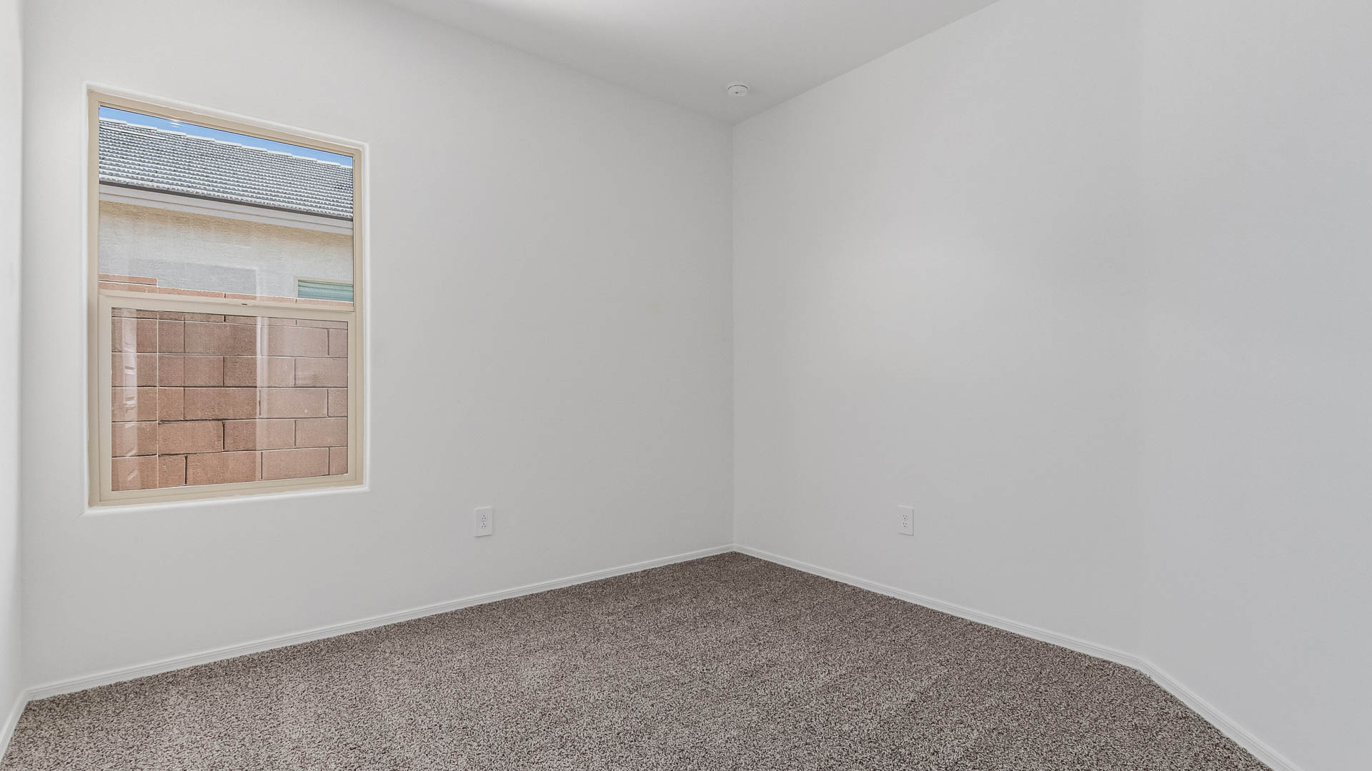 Welcome to The Parker at Barnett Village in Marana, Arizona – a stunning 1,909 sq. ft. single-story new home that combines space, comfort, and modern design for today’s growing families.  As you step through the inviting front porch and into the entryway, you’re immediately greeted by a well-thought-out floorplan that offers ample space for everyone. Just off the entry, Bedroom 5 is ideally situated for guests or as a private home office, complete with easy access to a full bathroom.  Moving further into the home, the spacious great room serves as the heart of The Parker. This open-concept area connects seamlessly to the dining room and kitchen, creating a perfect setting for both family gatherings and everyday living. The kitchen is a chef’s delight, featuring sleek granite countertops, modern appliances, a large island with a breakfast bar, and a walk-in pantry that ensures plenty of storage space.  Down a private hallway, you’ll discover the luxurious master suite. This spacious bedroom offers a serene retreat within the home, complete with a large walk-in closet and an en-suite bathroom featuring dual vanities and a walk-in shower. Three additional bedrooms are located nearby, sharing access to a full bathroom, making it easy to accommodate family and guests alike.  The Parker also includes a utility room conveniently located near the bedrooms, and a two-car garage that offers both storage and functionality.  Step outside from the great room to the covered patio – an ideal spot for enjoying Arizona’s beautiful weather year-round. Whether you’re hosting a barbecue or simply relaxing with a book, this outdoor space extends your living area into the serene surroundings of Barnett Village.  Designed with energy efficiency in mind, The Parker at Barnett Village is DOE Zero Energy Ready Home certified, ensuring a sustainable and cost-effective living environment.