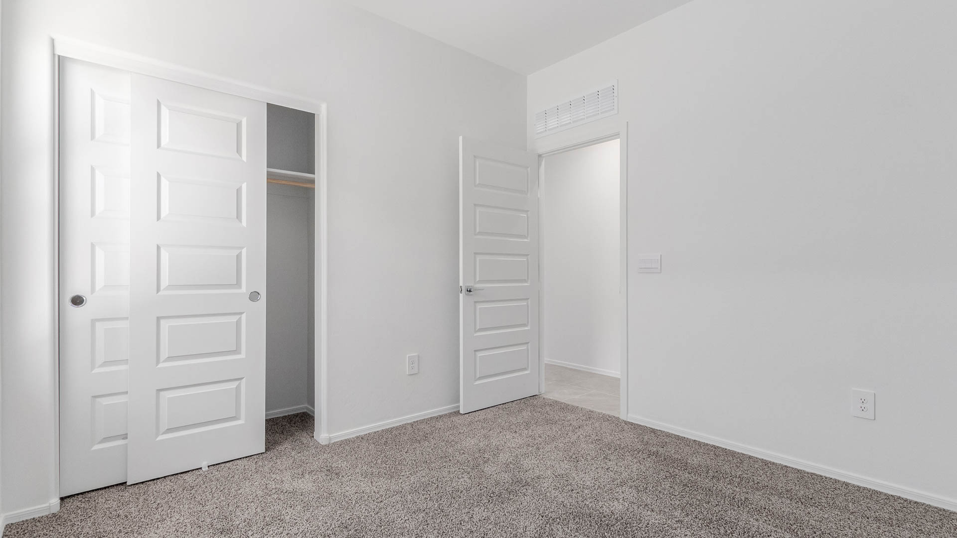 Welcome to The Parker at Barnett Village in Marana, Arizona – a stunning 1,909 sq. ft. single-story new home that combines space, comfort, and modern design for today’s growing families.  As you step through the inviting front porch and into the entryway, you’re immediately greeted by a well-thought-out floorplan that offers ample space for everyone. Just off the entry, Bedroom 5 is ideally situated for guests or as a private home office, complete with easy access to a full bathroom.  Moving further into the home, the spacious great room serves as the heart of The Parker. This open-concept area connects seamlessly to the dining room and kitchen, creating a perfect setting for both family gatherings and everyday living. The kitchen is a chef’s delight, featuring sleek granite countertops, modern appliances, a large island with a breakfast bar, and a walk-in pantry that ensures plenty of storage space.  Down a private hallway, you’ll discover the luxurious master suite. This spacious bedroom offers a serene retreat within the home, complete with a large walk-in closet and an en-suite bathroom featuring dual vanities and a walk-in shower. Three additional bedrooms are located nearby, sharing access to a full bathroom, making it easy to accommodate family and guests alike.  The Parker also includes a utility room conveniently located near the bedrooms, and a two-car garage that offers both storage and functionality.  Step outside from the great room to the covered patio – an ideal spot for enjoying Arizona’s beautiful weather year-round. Whether you’re hosting a barbecue or simply relaxing with a book, this outdoor space extends your living area into the serene surroundings of Barnett Village.  Designed with energy efficiency in mind, The Parker at Barnett Village is DOE Zero Energy Ready Home certified, ensuring a sustainable and cost-effective living environment.