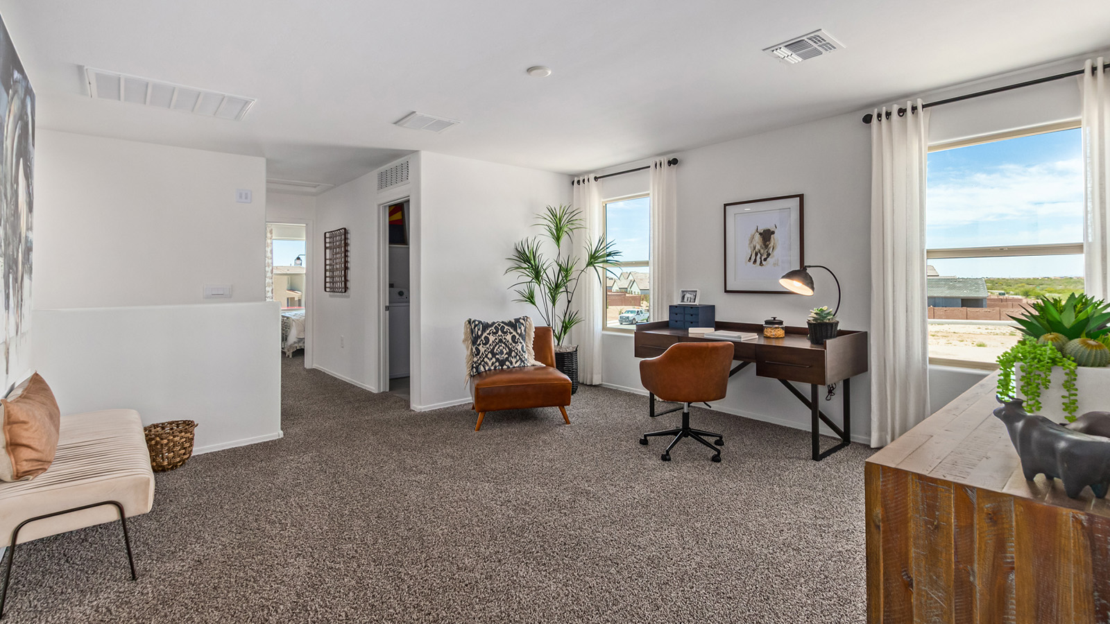 Introducing The Kate at Barnett Village in Marana, Arizona – the only two-story home in the community, offering an impressive 2,264 sq. ft. of living space designed to accommodate families of all sizes with ease and style.  As you enter through the charming front porch, you're greeted by an inviting entryway that leads directly into the heart of the home. The spacious great room opens up ahead, seamlessly connecting to the dining area and the gourmet kitchen. This open-concept space is perfect for entertaining, allowing for a natural flow from meal preparation to dining to relaxation. The kitchen features sleek granite countertops, a large island with a breakfast bar, modern appliances, and a walk-in pantry, making it both functional and stylish.  Tucked away on the main floor is a powder room, adding convenience for guests and everyday living.   Heading upstairs, you'll discover the family’s private quarters. The master suite is a true retreat, offering a generously sized bedroom, a large walk-in closet, and an en-suite bathroom complete with dual vanities and a walk-in shower. The upper level also includes three additional bedrooms, a full bathroom, and a versatile game room that can easily serve as a playroom, media room, or even a second living area.  For added convenience, the laundry room is located on the upper level, making household chores a breeze. The Kate also includes a two-car garage and energy-efficient features, ensuring long-term savings and a comfortable living environment.  Step outside from the great room to the covered patio, where you can enjoy Arizona’s stunning desert landscapes. Whether you’re hosting an outdoor gathering or simply relaxing after a long day, this space extends your living area and enhances the home’s inviting ambiance.  Designed with energy efficiency in mind, The Kate at Barnett Village is DOE Zero Energy Ready Home certified, combining sustainability with modern comfort.