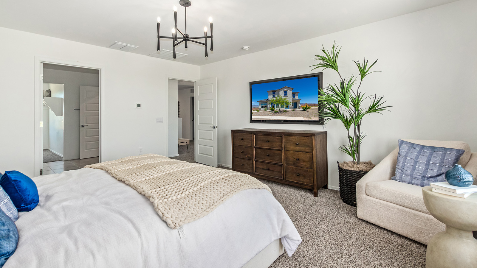 Introducing The Kate at Barnett Village in Marana, Arizona – the only two-story home in the community, offering an impressive 2,264 sq. ft. of living space designed to accommodate families of all sizes with ease and style.  As you enter through the charming front porch, you're greeted by an inviting entryway that leads directly into the heart of the home. The spacious great room opens up ahead, seamlessly connecting to the dining area and the gourmet kitchen. This open-concept space is perfect for entertaining, allowing for a natural flow from meal preparation to dining to relaxation. The kitchen features sleek granite countertops, a large island with a breakfast bar, modern appliances, and a walk-in pantry, making it both functional and stylish.  Tucked away on the main floor is a powder room, adding convenience for guests and everyday living.   Heading upstairs, you'll discover the family’s private quarters. The master suite is a true retreat, offering a generously sized bedroom, a large walk-in closet, and an en-suite bathroom complete with dual vanities and a walk-in shower. The upper level also includes three additional bedrooms, a full bathroom, and a versatile game room that can easily serve as a playroom, media room, or even a second living area.  For added convenience, the laundry room is located on the upper level, making household chores a breeze. The Kate also includes a two-car garage and energy-efficient features, ensuring long-term savings and a comfortable living environment.  Step outside from the great room to the covered patio, where you can enjoy Arizona’s stunning desert landscapes. Whether you’re hosting an outdoor gathering or simply relaxing after a long day, this space extends your living area and enhances the home’s inviting ambiance.  Designed with energy efficiency in mind, The Kate at Barnett Village is DOE Zero Energy Ready Home certified, combining sustainability with modern comfort.