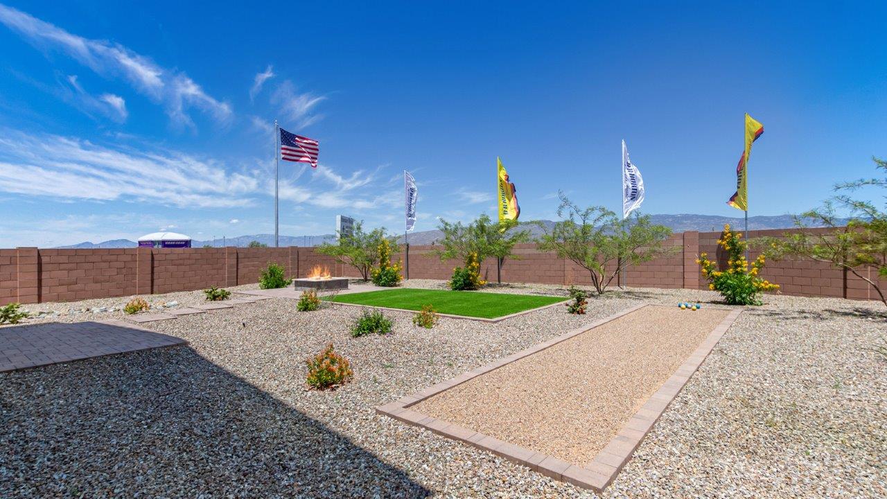 Introducing The Kate at Barnett Village in Marana, Arizona – the only two-story home in the community, offering an impressive 2,264 sq. ft. of living space designed to accommodate families of all sizes with ease and style.  As you enter through the charming front porch, you're greeted by an inviting entryway that leads directly into the heart of the home. The spacious great room opens up ahead, seamlessly connecting to the dining area and the gourmet kitchen. This open-concept space is perfect for entertaining, allowing for a natural flow from meal preparation to dining to relaxation. The kitchen features sleek granite countertops, a large island with a breakfast bar, modern appliances, and a walk-in pantry, making it both functional and stylish.  Tucked away on the main floor is a powder room, adding convenience for guests and everyday living.   Heading upstairs, you'll discover the family’s private quarters. The master suite is a true retreat, offering a generously sized bedroom, a large walk-in closet, and an en-suite bathroom complete with dual vanities and a walk-in shower. The upper level also includes three additional bedrooms, a full bathroom, and a versatile game room that can easily serve as a playroom, media room, or even a second living area.  For added convenience, the laundry room is located on the upper level, making household chores a breeze. The Kate also includes a two-car garage and energy-efficient features, ensuring long-term savings and a comfortable living environment.  Step outside from the great room to the covered patio, where you can enjoy Arizona’s stunning desert landscapes. Whether you’re hosting an outdoor gathering or simply relaxing after a long day, this space extends your living area and enhances the home’s inviting ambiance.  Designed with energy efficiency in mind, The Kate at Barnett Village is DOE Zero Energy Ready Home certified, combining sustainability with modern comfort.