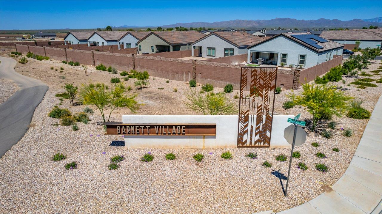 Explore The Dalton at Barnett Village in Marana, Arizona – a spacious 1,569 sq. ft. single-story new home designed to accommodate both comfort and convenience for modern living.  As you step through the front porch and into the welcoming entryway, you're immediately led into a thoughtfully designed space that maximizes every square foot. To the left, you’ll find Bedroom 4, ideal for guests or a home office, offering privacy and easy access to the main living areas.  Continuing through the home, you’ll enter the heart of The Dalton – an expansive great room that seamlessly connects to the dining area and kitchen. This open-concept space is perfect for entertaining or everyday family living, allowing for a fluid transition from cooking to dining to relaxation. The kitchen is equipped with sleek granite countertops, modern appliances, a walk-in pantry, and an island that doubles as a breakfast bar, providing ample space for meal prep and casual dining.  Adjacent to the great room, a hallway leads to three additional bedrooms, including the spacious master suite. The master bedroom offers a serene retreat with a large walk-in closet and an en-suite bathroom featuring dual vanities and a walk-in shower. The two secondary bedrooms share a well-appointed full bathroom, making it convenient for family members or guests.  The Dalton also includes a utility room that adds functionality and storage options to the home, as well as direct access to a two-car garage.  Step outside from the great room to the covered patio – a perfect spot to enjoy Arizona’s beautiful weather year-round, whether you’re sipping your morning coffee or hosting an evening barbecue.  Designed with energy efficiency in mind, The Dalton at Barnett Village is DOE Zero Energy Ready Home certified, ensuring long-term savings and a comfortable living environment.
