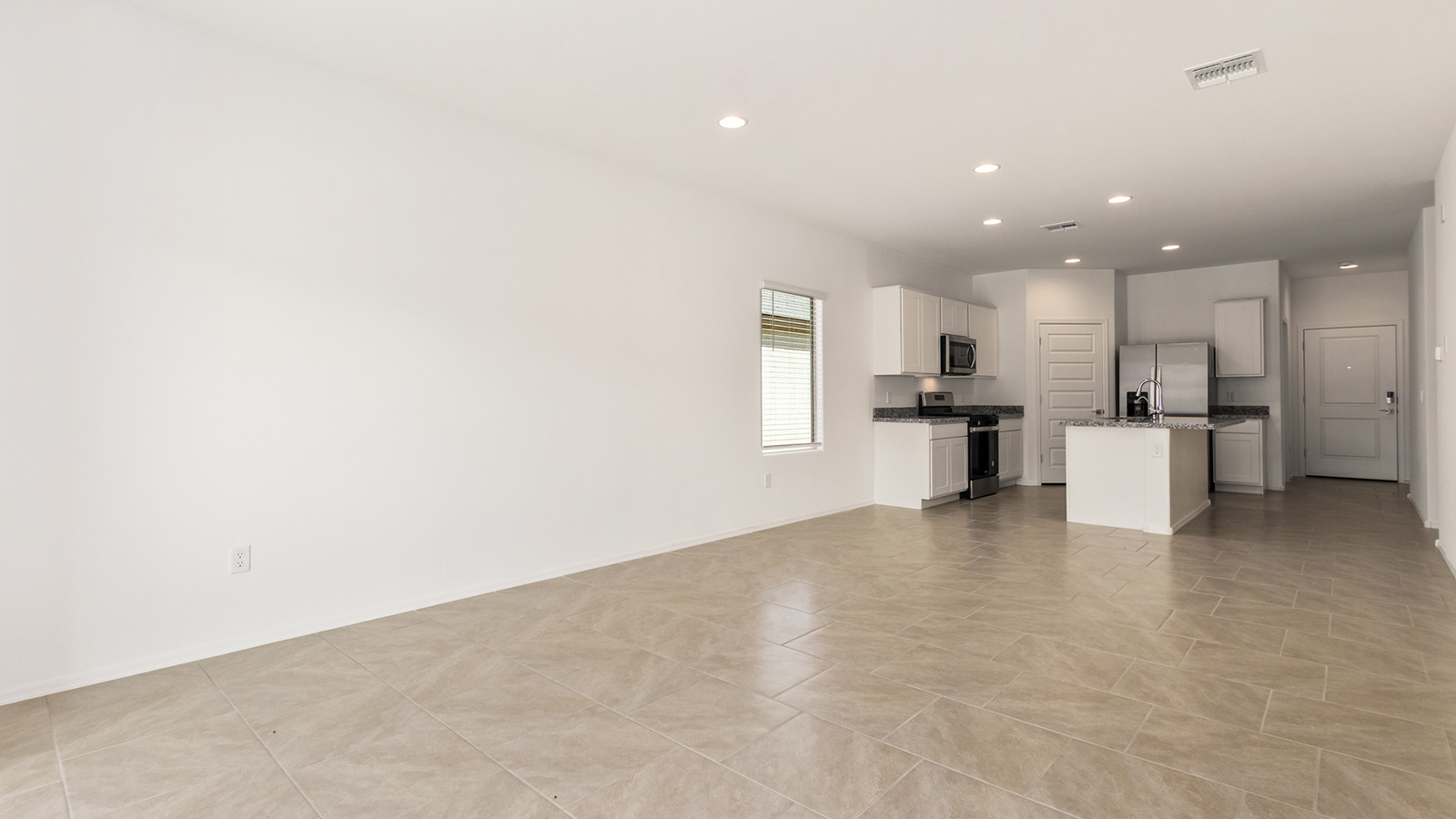 Explore The Dalton at Barnett Village in Marana, Arizona – a spacious 1,569 sq. ft. single-story new home designed to accommodate both comfort and convenience for modern living.  As you step through the front porch and into the welcoming entryway, you're immediately led into a thoughtfully designed space that maximizes every square foot. To the left, you’ll find Bedroom 4, ideal for guests or a home office, offering privacy and easy access to the main living areas.  Continuing through the home, you’ll enter the heart of The Dalton – an expansive great room that seamlessly connects to the dining area and kitchen. This open-concept space is perfect for entertaining or everyday family living, allowing for a fluid transition from cooking to dining to relaxation. The kitchen is equipped with sleek granite countertops, modern appliances, a walk-in pantry, and an island that doubles as a breakfast bar, providing ample space for meal prep and casual dining.  Adjacent to the great room, a hallway leads to three additional bedrooms, including the spacious master suite. The master bedroom offers a serene retreat with a large walk-in closet and an en-suite bathroom featuring dual vanities and a walk-in shower. The two secondary bedrooms share a well-appointed full bathroom, making it convenient for family members or guests.  The Dalton also includes a utility room that adds functionality and storage options to the home, as well as direct access to a two-car garage.  Step outside from the great room to the covered patio – a perfect spot to enjoy Arizona’s beautiful weather year-round, whether you’re sipping your morning coffee or hosting an evening barbecue.  Designed with energy efficiency in mind, The Dalton at Barnett Village is DOE Zero Energy Ready Home certified, ensuring long-term savings and a comfortable living environment.