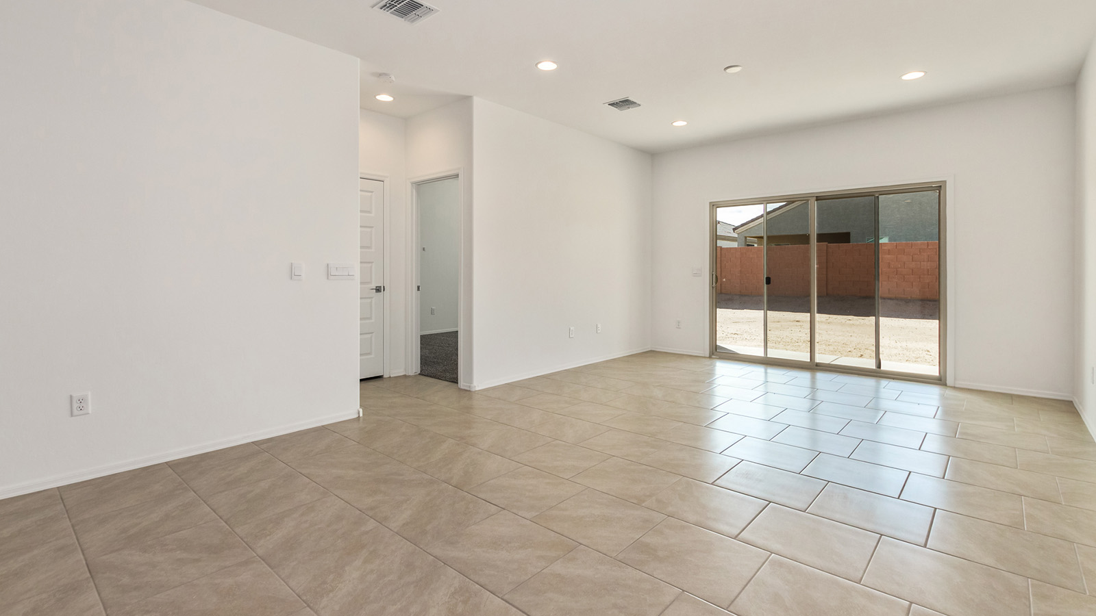 Explore The Dalton at Barnett Village in Marana, Arizona – a spacious 1,569 sq. ft. single-story new home designed to accommodate both comfort and convenience for modern living.  As you step through the front porch and into the welcoming entryway, you're immediately led into a thoughtfully designed space that maximizes every square foot. To the left, you’ll find Bedroom 4, ideal for guests or a home office, offering privacy and easy access to the main living areas.  Continuing through the home, you’ll enter the heart of The Dalton – an expansive great room that seamlessly connects to the dining area and kitchen. This open-concept space is perfect for entertaining or everyday family living, allowing for a fluid transition from cooking to dining to relaxation. The kitchen is equipped with sleek granite countertops, modern appliances, a walk-in pantry, and an island that doubles as a breakfast bar, providing ample space for meal prep and casual dining.  Adjacent to the great room, a hallway leads to three additional bedrooms, including the spacious master suite. The master bedroom offers a serene retreat with a large walk-in closet and an en-suite bathroom featuring dual vanities and a walk-in shower. The two secondary bedrooms share a well-appointed full bathroom, making it convenient for family members or guests.  The Dalton also includes a utility room that adds functionality and storage options to the home, as well as direct access to a two-car garage.  Step outside from the great room to the covered patio – a perfect spot to enjoy Arizona’s beautiful weather year-round, whether you’re sipping your morning coffee or hosting an evening barbecue.  Designed with energy efficiency in mind, The Dalton at Barnett Village is DOE Zero Energy Ready Home certified, ensuring long-term savings and a comfortable living environment.