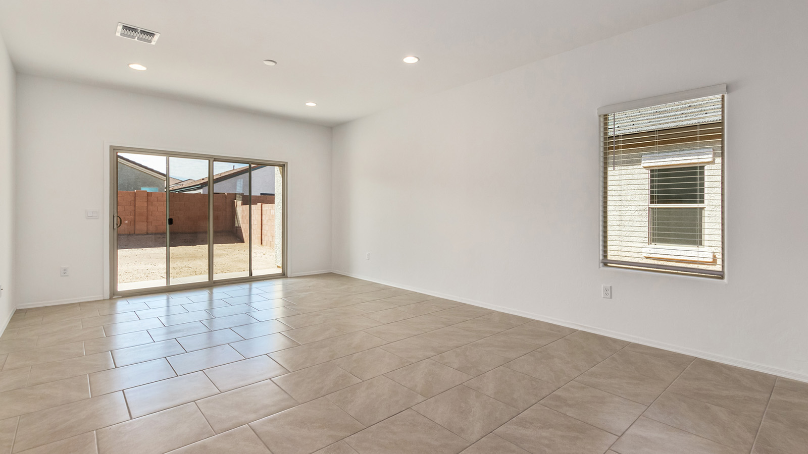 Explore The Dalton at Barnett Village in Marana, Arizona – a spacious 1,569 sq. ft. single-story new home designed to accommodate both comfort and convenience for modern living.  As you step through the front porch and into the welcoming entryway, you're immediately led into a thoughtfully designed space that maximizes every square foot. To the left, you’ll find Bedroom 4, ideal for guests or a home office, offering privacy and easy access to the main living areas.  Continuing through the home, you’ll enter the heart of The Dalton – an expansive great room that seamlessly connects to the dining area and kitchen. This open-concept space is perfect for entertaining or everyday family living, allowing for a fluid transition from cooking to dining to relaxation. The kitchen is equipped with sleek granite countertops, modern appliances, a walk-in pantry, and an island that doubles as a breakfast bar, providing ample space for meal prep and casual dining.  Adjacent to the great room, a hallway leads to three additional bedrooms, including the spacious master suite. The master bedroom offers a serene retreat with a large walk-in closet and an en-suite bathroom featuring dual vanities and a walk-in shower. The two secondary bedrooms share a well-appointed full bathroom, making it convenient for family members or guests.  The Dalton also includes a utility room that adds functionality and storage options to the home, as well as direct access to a two-car garage.  Step outside from the great room to the covered patio – a perfect spot to enjoy Arizona’s beautiful weather year-round, whether you’re sipping your morning coffee or hosting an evening barbecue.  Designed with energy efficiency in mind, The Dalton at Barnett Village is DOE Zero Energy Ready Home certified, ensuring long-term savings and a comfortable living environment.