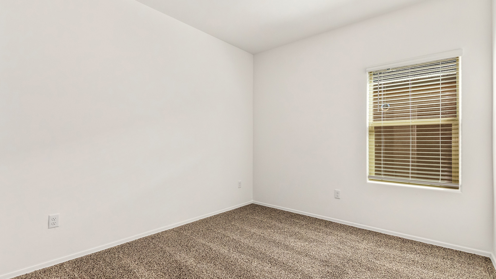 Explore The Dalton at Barnett Village in Marana, Arizona – a spacious 1,569 sq. ft. single-story new home designed to accommodate both comfort and convenience for modern living.  As you step through the front porch and into the welcoming entryway, you're immediately led into a thoughtfully designed space that maximizes every square foot. To the left, you’ll find Bedroom 4, ideal for guests or a home office, offering privacy and easy access to the main living areas.  Continuing through the home, you’ll enter the heart of The Dalton – an expansive great room that seamlessly connects to the dining area and kitchen. This open-concept space is perfect for entertaining or everyday family living, allowing for a fluid transition from cooking to dining to relaxation. The kitchen is equipped with sleek granite countertops, modern appliances, a walk-in pantry, and an island that doubles as a breakfast bar, providing ample space for meal prep and casual dining.  Adjacent to the great room, a hallway leads to three additional bedrooms, including the spacious master suite. The master bedroom offers a serene retreat with a large walk-in closet and an en-suite bathroom featuring dual vanities and a walk-in shower. The two secondary bedrooms share a well-appointed full bathroom, making it convenient for family members or guests.  The Dalton also includes a utility room that adds functionality and storage options to the home, as well as direct access to a two-car garage.  Step outside from the great room to the covered patio – a perfect spot to enjoy Arizona’s beautiful weather year-round, whether you’re sipping your morning coffee or hosting an evening barbecue.  Designed with energy efficiency in mind, The Dalton at Barnett Village is DOE Zero Energy Ready Home certified, ensuring long-term savings and a comfortable living environment.