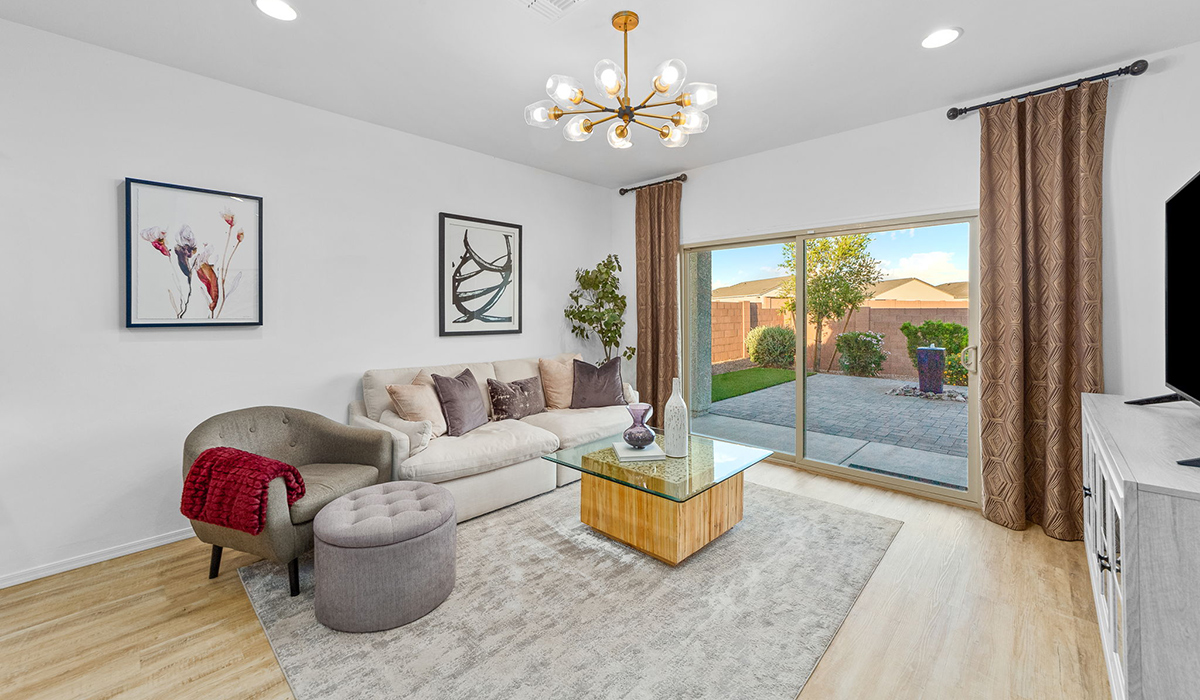 Welcome to The Harris at Barnett Village in Marana, Arizona – our beautifully designed home, offering 1,856 sq. ft. of modern living space that combines elegance with functionality.  Step through the inviting front porch and into a thoughtfully planned interior that begins with a welcoming entryway. This home features two of the four bedrooms near the entrance of the home, both sharing easy access to a full bathroom. These rooms are perfect for guests, children, or even a home office, providing comfort for various lifestyle needs.  As you continue through the spacious great room is revealed, the central hub of the home that seamlessly connects to the dining area and kitchen. The kitchen is a chef’s delight, complete with quartz countertops, large island with a breakfast bar, walk-in pantry, and state-of-the-art appliances.  Adjacent to the great room, a private hallway leads to the primary suite – a tranquil retreat within the home. The primary bedroom features a large walk-in closet and en-suite bathroom. Additionally, the suite offers direct access to a powder room, enhancing the convenience and privacy of this luxurious space.  The Harris also includes a utility room and a two-car garage adding to the home’s practical features, ensuring that daily routines are smooth and efficient.  Step outside to the covered patio, where you can unwind and take in the scenic beauty of Barnett Village. Whether you’re enjoying a quiet morning coffee or hosting a lively evening gathering, this outdoor space extends your living area and provides the perfect backdrop for Arizona’s desert landscapes.  *Images shown are for reference only. They depict The Harris sales model home and may not represent the actual home.