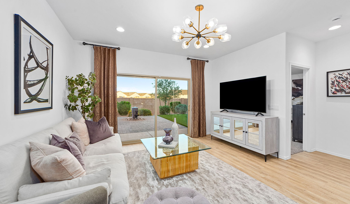 Welcome to The Harris at Barnett Village in Marana, Arizona – our beautifully designed home, offering 1,856 sq. ft. of modern living space that combines elegance with functionality.  Step through the inviting front porch and into a thoughtfully planned interior that begins with a welcoming entryway. This home features two of the four bedrooms near the entrance of the home, both sharing easy access to a full bathroom. These rooms are perfect for guests, children, or even a home office, providing comfort for various lifestyle needs.  As you continue through the spacious great room is revealed, the central hub of the home that seamlessly connects to the dining area and kitchen. The kitchen is a chef’s delight, complete with quartz countertops, large island with a breakfast bar, walk-in pantry, and state-of-the-art appliances.  Adjacent to the great room, a private hallway leads to the primary suite – a tranquil retreat within the home. The primary bedroom features a large walk-in closet and en-suite bathroom. Additionally, the suite offers direct access to a powder room, enhancing the convenience and privacy of this luxurious space.  The Harris also includes a utility room and a two-car garage adding to the home’s practical features, ensuring that daily routines are smooth and efficient.  Step outside to the covered patio, where you can unwind and take in the scenic beauty of Barnett Village. Whether you’re enjoying a quiet morning coffee or hosting a lively evening gathering, this outdoor space extends your living area and provides the perfect backdrop for Arizona’s desert landscapes.  *Images shown are for reference only. They depict The Harris sales model home and may not represent the actual home.
