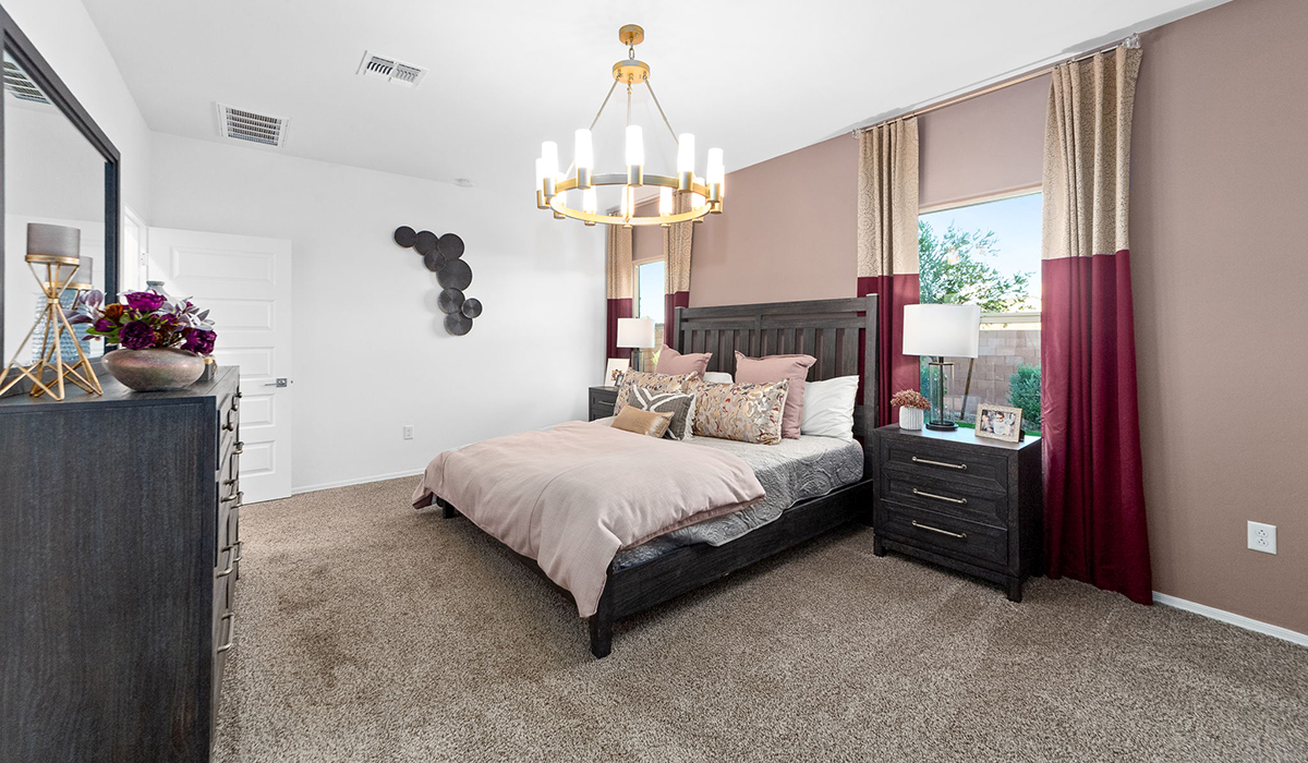 Welcome to The Harris at Barnett Village in Marana, Arizona – our beautifully designed home, offering 1,856 sq. ft. of modern living space that combines elegance with functionality.  Step through the inviting front porch and into a thoughtfully planned interior that begins with a welcoming entryway. This home features two of the four bedrooms near the entrance of the home, both sharing easy access to a full bathroom. These rooms are perfect for guests, children, or even a home office, providing comfort for various lifestyle needs.  As you continue through the spacious great room is revealed, the central hub of the home that seamlessly connects to the dining area and kitchen. The kitchen is a chef’s delight, complete with quartz countertops, large island with a breakfast bar, walk-in pantry, and state-of-the-art appliances.  Adjacent to the great room, a private hallway leads to the primary suite – a tranquil retreat within the home. The primary bedroom features a large walk-in closet and en-suite bathroom. Additionally, the suite offers direct access to a powder room, enhancing the convenience and privacy of this luxurious space.  The Harris also includes a utility room and a two-car garage adding to the home’s practical features, ensuring that daily routines are smooth and efficient.  Step outside to the covered patio, where you can unwind and take in the scenic beauty of Barnett Village. Whether you’re enjoying a quiet morning coffee or hosting a lively evening gathering, this outdoor space extends your living area and provides the perfect backdrop for Arizona’s desert landscapes.  *Images shown are for reference only. They depict The Harris sales model home and may not represent the actual home.