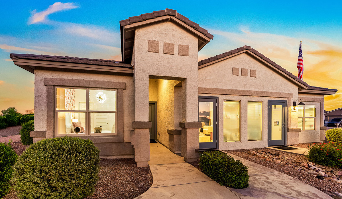 Welcome to The Harris at Barnett Village in Marana, Arizona – our beautifully designed home, offering 1,856 sq. ft. of modern living space that combines elegance with functionality.  Step through the inviting front porch and into a thoughtfully planned interior that begins with a welcoming entryway. This home features two of the four bedrooms near the entrance of the home, both sharing easy access to a full bathroom. These rooms are perfect for guests, children, or even a home office, providing comfort for various lifestyle needs.  As you continue through the spacious great room is revealed, the central hub of the home that seamlessly connects to the dining area and kitchen. The kitchen is a chef’s delight, complete with quartz countertops, large island with a breakfast bar, walk-in pantry, and state-of-the-art appliances.  Adjacent to the great room, a private hallway leads to the primary suite – a tranquil retreat within the home. The primary bedroom features a large walk-in closet and en-suite bathroom. Additionally, the suite offers direct access to a powder room, enhancing the convenience and privacy of this luxurious space.  The Harris also includes a utility room and a two-car garage adding to the home’s practical features, ensuring that daily routines are smooth and efficient.  Step outside to the covered patio, where you can unwind and take in the scenic beauty of Barnett Village. Whether you’re enjoying a quiet morning coffee or hosting a lively evening gathering, this outdoor space extends your living area and provides the perfect backdrop for Arizona’s desert landscapes.  *Images shown are for reference only. They depict The Harris sales model home and may not represent the actual home.