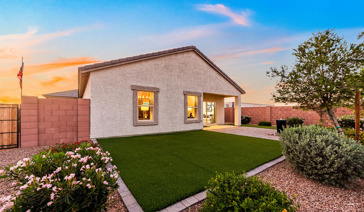 Welcome to The Harris at Barnett Village in Marana, Arizona – our beautifully designed home, offering 1,856 sq. ft. of modern living space that combines elegance with functionality.  Step through the inviting front porch and into a thoughtfully planned interior that begins with a welcoming entryway. This home features two of the four bedrooms near the entrance of the home, both sharing easy access to a full bathroom. These rooms are perfect for guests, children, or even a home office, providing comfort for various lifestyle needs.  As you continue through the spacious great room is revealed, the central hub of the home that seamlessly connects to the dining area and kitchen. The kitchen is a chef’s delight, complete with quartz countertops, large island with a breakfast bar, walk-in pantry, and state-of-the-art appliances.  Adjacent to the great room, a private hallway leads to the primary suite – a tranquil retreat within the home. The primary bedroom features a large walk-in closet and en-suite bathroom. Additionally, the suite offers direct access to a powder room, enhancing the convenience and privacy of this luxurious space.  The Harris also includes a utility room and a two-car garage adding to the home’s practical features, ensuring that daily routines are smooth and efficient.  Step outside to the covered patio, where you can unwind and take in the scenic beauty of Barnett Village. Whether you’re enjoying a quiet morning coffee or hosting a lively evening gathering, this outdoor space extends your living area and provides the perfect backdrop for Arizona’s desert landscapes.  *Images shown are for reference only. They depict The Harris sales model home and may not represent the actual home.