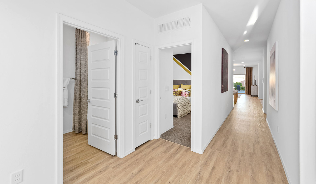 Welcome to The Harris at Barnett Village in Marana, Arizona – our beautifully designed home, offering 1,856 sq. ft. of modern living space that combines elegance with functionality.  Step through the inviting front porch and into a thoughtfully planned interior that begins with a welcoming entryway. This home features two of the four bedrooms near the entrance of the home, both sharing easy access to a full bathroom. These rooms are perfect for guests, children, or even a home office, providing comfort for various lifestyle needs.  As you continue through the spacious great room is revealed, the central hub of the home that seamlessly connects to the dining area and kitchen. The kitchen is a chef’s delight, complete with quartz countertops, large island with a breakfast bar, walk-in pantry, and state-of-the-art appliances.  Adjacent to the great room, a private hallway leads to the primary suite – a tranquil retreat within the home. The primary bedroom features a large walk-in closet and en-suite bathroom. Additionally, the suite offers direct access to a powder room, enhancing the convenience and privacy of this luxurious space.  The Harris also includes a utility room and a two-car garage adding to the home’s practical features, ensuring that daily routines are smooth and efficient.  Step outside to the covered patio, where you can unwind and take in the scenic beauty of Barnett Village. Whether you’re enjoying a quiet morning coffee or hosting a lively evening gathering, this outdoor space extends your living area and provides the perfect backdrop for Arizona’s desert landscapes.  *Images shown are for reference only. They depict The Harris sales model home and may not represent the actual home.
