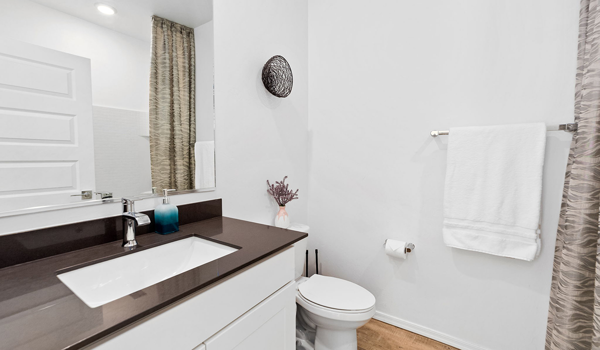 Welcome to The Harris at Barnett Village in Marana, Arizona – our beautifully designed home, offering 1,856 sq. ft. of modern living space that combines elegance with functionality.  Step through the inviting front porch and into a thoughtfully planned interior that begins with a welcoming entryway. This home features two of the four bedrooms near the entrance of the home, both sharing easy access to a full bathroom. These rooms are perfect for guests, children, or even a home office, providing comfort for various lifestyle needs.  As you continue through the spacious great room is revealed, the central hub of the home that seamlessly connects to the dining area and kitchen. The kitchen is a chef’s delight, complete with quartz countertops, large island with a breakfast bar, walk-in pantry, and state-of-the-art appliances.  Adjacent to the great room, a private hallway leads to the primary suite – a tranquil retreat within the home. The primary bedroom features a large walk-in closet and en-suite bathroom. Additionally, the suite offers direct access to a powder room, enhancing the convenience and privacy of this luxurious space.  The Harris also includes a utility room and a two-car garage adding to the home’s practical features, ensuring that daily routines are smooth and efficient.  Step outside to the covered patio, where you can unwind and take in the scenic beauty of Barnett Village. Whether you’re enjoying a quiet morning coffee or hosting a lively evening gathering, this outdoor space extends your living area and provides the perfect backdrop for Arizona’s desert landscapes.  Designed with energy efficiency, The Harris at Barnett Village is DOE Zero Energy Ready Home certified.  *Images shown are for reference only. They depict the sales model home and may not represent the actual home.