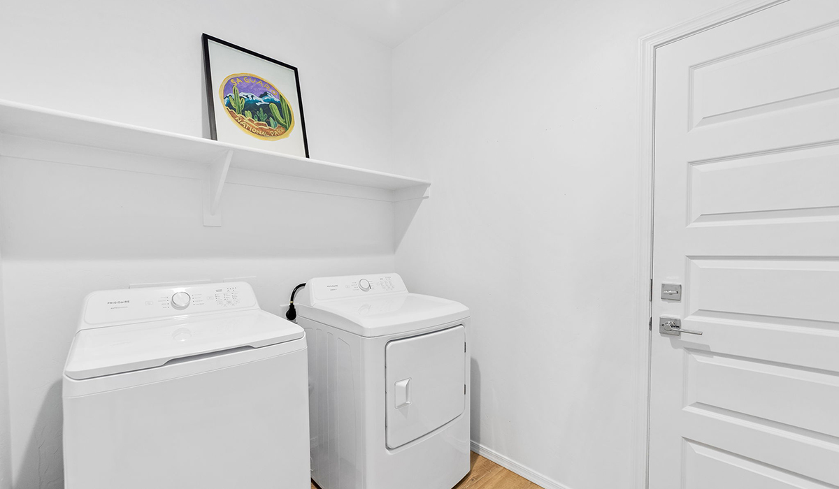 Welcome to The Harris at Barnett Village in Marana, Arizona – our beautifully designed home, offering 1,856 sq. ft. of modern living space that combines elegance with functionality.  Step through the inviting front porch and into a thoughtfully planned interior that begins with a welcoming entryway. This home features two of the four bedrooms near the entrance of the home, both sharing easy access to a full bathroom. These rooms are perfect for guests, children, or even a home office, providing comfort for various lifestyle needs.  As you continue through the spacious great room is revealed, the central hub of the home that seamlessly connects to the dining area and kitchen. The kitchen is a chef’s delight, complete with quartz countertops, large island with a breakfast bar, walk-in pantry, and state-of-the-art appliances.  Adjacent to the great room, a private hallway leads to the primary suite – a tranquil retreat within the home. The primary bedroom features a large walk-in closet and en-suite bathroom. Additionally, the suite offers direct access to a powder room, enhancing the convenience and privacy of this luxurious space.  The Harris also includes a utility room and a two-car garage adding to the home’s practical features, ensuring that daily routines are smooth and efficient.  Step outside to the covered patio, where you can unwind and take in the scenic beauty of Barnett Village. Whether you’re enjoying a quiet morning coffee or hosting a lively evening gathering, this outdoor space extends your living area and provides the perfect backdrop for Arizona’s desert landscapes.  Designed with energy efficiency, The Harris at Barnett Village is DOE Zero Energy Ready Home certified.  *Images shown are for reference only. They depict the sales model home and may not represent the actual home.