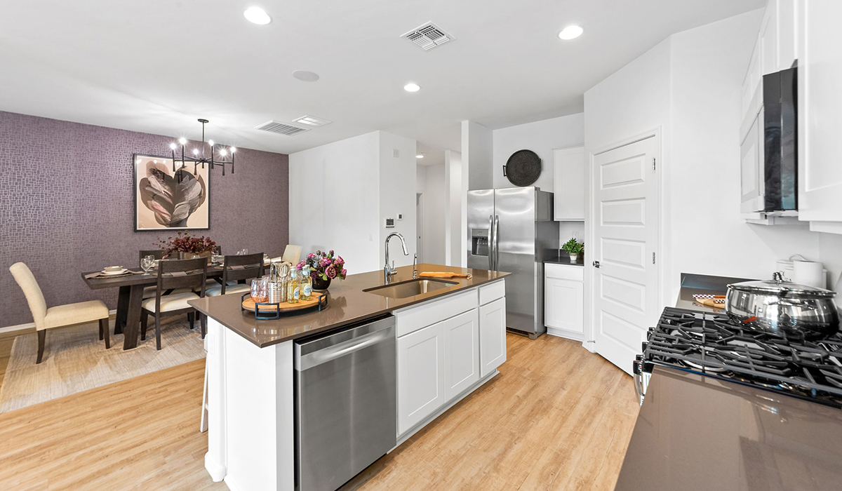 Welcome to The Harris at Barnett Village in Marana, Arizona – our beautifully designed home, offering 1,856 sq. ft. of modern living space that combines elegance with functionality.  Step through the inviting front porch and into a thoughtfully planned interior that begins with a welcoming entryway. This home features two of the four bedrooms near the entrance of the home, both sharing easy access to a full bathroom. These rooms are perfect for guests, children, or even a home office, providing comfort for various lifestyle needs.  As you continue through the spacious great room is revealed, the central hub of the home that seamlessly connects to the dining area and kitchen. The kitchen is a chef’s delight, complete with quartz countertops, large island with a breakfast bar, walk-in pantry, and state-of-the-art appliances.  Adjacent to the great room, a private hallway leads to the primary suite – a tranquil retreat within the home. The primary bedroom features a large walk-in closet and en-suite bathroom. Additionally, the suite offers direct access to a powder room, enhancing the convenience and privacy of this luxurious space.  The Harris also includes a utility room and a two-car garage adding to the home’s practical features, ensuring that daily routines are smooth and efficient.  Step outside to the covered patio, where you can unwind and take in the scenic beauty of Barnett Village. Whether you’re enjoying a quiet morning coffee or hosting a lively evening gathering, this outdoor space extends your living area and provides the perfect backdrop for Arizona’s desert landscapes.  Designed with energy efficiency, The Harris at Barnett Village is DOE Zero Energy Ready Home certified.  *Images shown are for reference only. They depict the sales model home and may not represent the actual home.