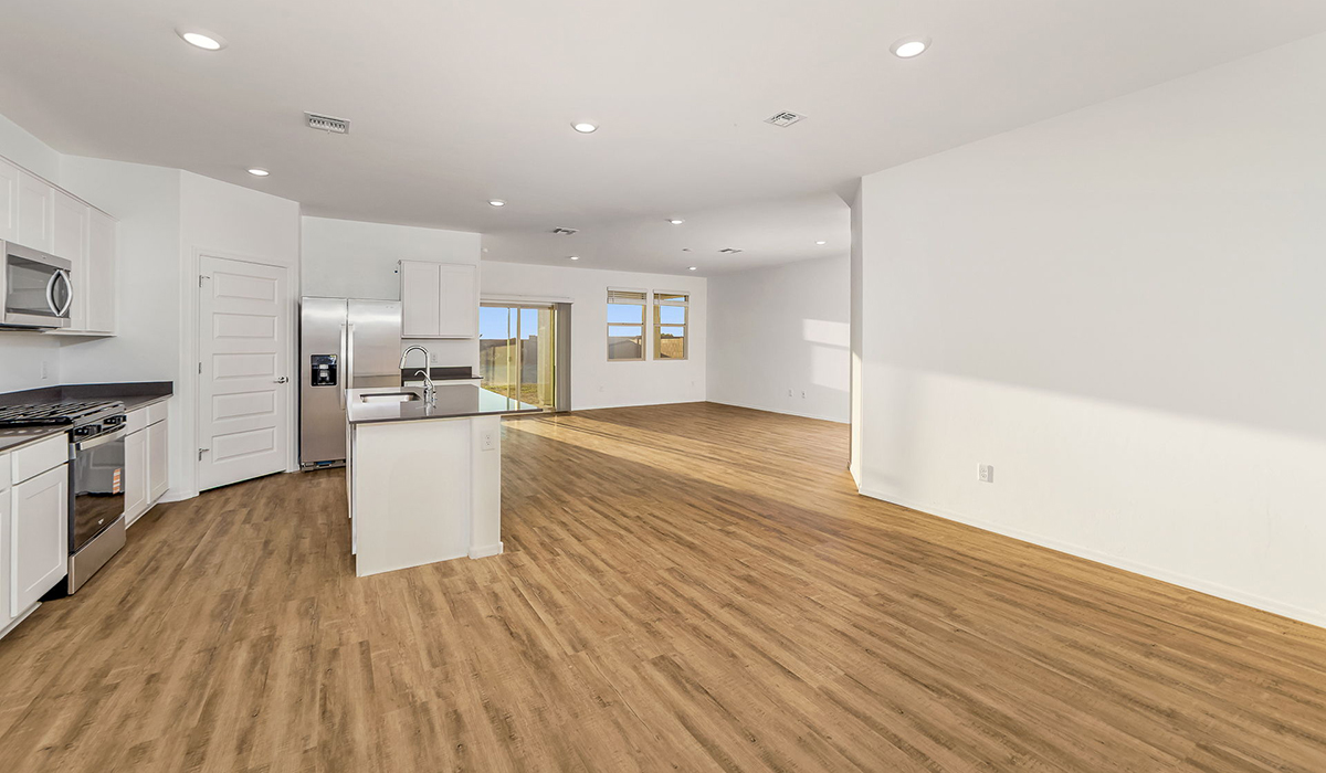 Step into The Dalea at Barnett Village, Marana, Arizona – a perfect blend of comfort, modern living, and energy efficiency. This thoughtfully crafted one-story home spans 2,224 square feet and offers five bedrooms and 3 bathrooms, ideal for families of all sizes.  The open-concept design features a spacious great room that effortlessly connects with the kitchen and dining area, creating an inviting central hub for everyday living and entertaining. The kitchen is equipped with contemporary appliances and a pantry, offering ample storage and convenience for meal preparation.  The primary bedroom, located at the rear of the home, provides a peaceful retreat with a private ensuite bathroom and a generous walk-in closet. The additional four bedrooms are positioned at the front of the house, offering versatility for use as guest rooms, a home office, or children’s bedrooms.  The Dalea floor plan offers the option of a three-car tandem garage, perfect for additional space and larger sized vehicles. Whether it’s morning coffee or evening relaxation, this outdoor space extends your living area into the serene landscape of Barnett Village.  Built with energy efficiency as a priority, the Dalea includes smart home technology, which not only simplifies daily living but also helps reduce utility costs.