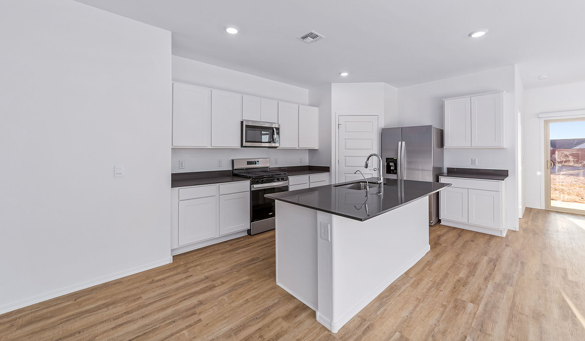 Step into The Dalea at Barnett Village, Marana, Arizona – a perfect blend of comfort, modern living, and energy efficiency. This thoughtfully crafted one-story home spans 2,224 square feet and offers five bedrooms and 3 bathrooms, ideal for families of all sizes.  The open-concept design features a spacious great room that effortlessly connects with the kitchen and dining area, creating an inviting central hub for everyday living and entertaining. The kitchen is equipped with contemporary appliances and a pantry, offering ample storage and convenience for meal preparation.  The primary bedroom, located at the rear of the home, provides a peaceful retreat with a private ensuite bathroom and a generous walk-in closet. The additional four bedrooms are positioned at the front of the house, offering versatility for use as guest rooms, a home office, or children’s bedrooms.  The Dalea floor plan offers the option of a three-car tandem garage, perfect for additional space and larger sized vehicles. Whether it’s morning coffee or evening relaxation, this outdoor space extends your living area into the serene landscape of Barnett Village.  Built with energy efficiency as a priority, the Dalea includes smart home technology, which not only simplifies daily living but also helps reduce utility costs.  *Images shown are for reference only. They depict the Dalea floor plan but may not represent the actual home and design package.