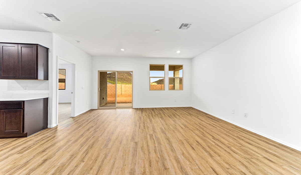 Step into The Dalea at Barnett Village, Marana, Arizona – a perfect blend of comfort, modern living, and energy efficiency. This thoughtfully crafted one-story home spans 2,224 square feet and offers five bedrooms and 3 bathrooms, ideal for families of all sizes.  The open-concept design features a spacious great room that effortlessly connects with the kitchen and dining area, creating an inviting central hub for everyday living and entertaining. The kitchen is equipped with contemporary appliances and a pantry, offering ample storage and convenience for meal preparation.  The primary bedroom, located at the rear of the home, provides a peaceful retreat with a private ensuite bathroom and a generous walk-in closet. The additional four bedrooms are positioned at the front of the house, offering versatility for use as guest rooms, a home office, or children’s bedrooms.  The Dalea floor plan offers the option of a three-car tandem garage, perfect for additional space and larger sized vehicles. Whether it’s morning coffee or evening relaxation, this outdoor space extends your living area into the serene landscape of Barnett Village.  Built with energy efficiency as a priority, the Dalea includes smart home technology, which not only simplifies daily living but also helps reduce utility costs.