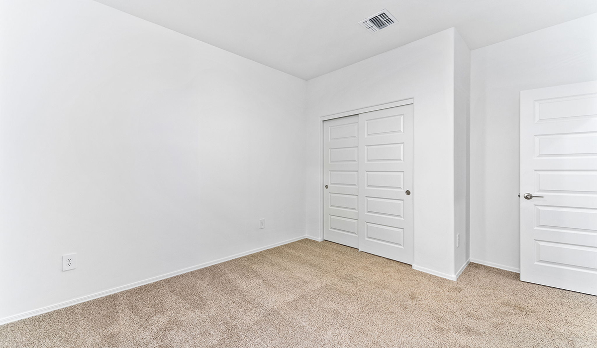 Step into The Dalea at Barnett Village, Marana, Arizona – a perfect blend of comfort, modern living, and energy efficiency. This thoughtfully crafted one-story home spans 2,224 square feet and offers five bedrooms and 3 bathrooms, ideal for families of all sizes.  The open-concept design features a spacious great room that effortlessly connects with the kitchen and dining area, creating an inviting central hub for everyday living and entertaining. The kitchen is equipped with contemporary appliances and a pantry, offering ample storage and convenience for meal preparation.  The primary bedroom, located at the rear of the home, provides a peaceful retreat with a private ensuite bathroom and a generous walk-in closet. The additional four bedrooms are positioned at the front of the house, offering versatility for use as guest rooms, a home office, or children’s bedrooms.  The Dalea floor plan offers the option of a three-car tandem garage, perfect for additional space and larger sized vehicles. Whether it’s morning coffee or evening relaxation, this outdoor space extends your living area into the serene landscape of Barnett Village.  Built with energy efficiency as a priority, the Dalea includes smart home technology, which not only simplifies daily living but also helps reduce utility costs.