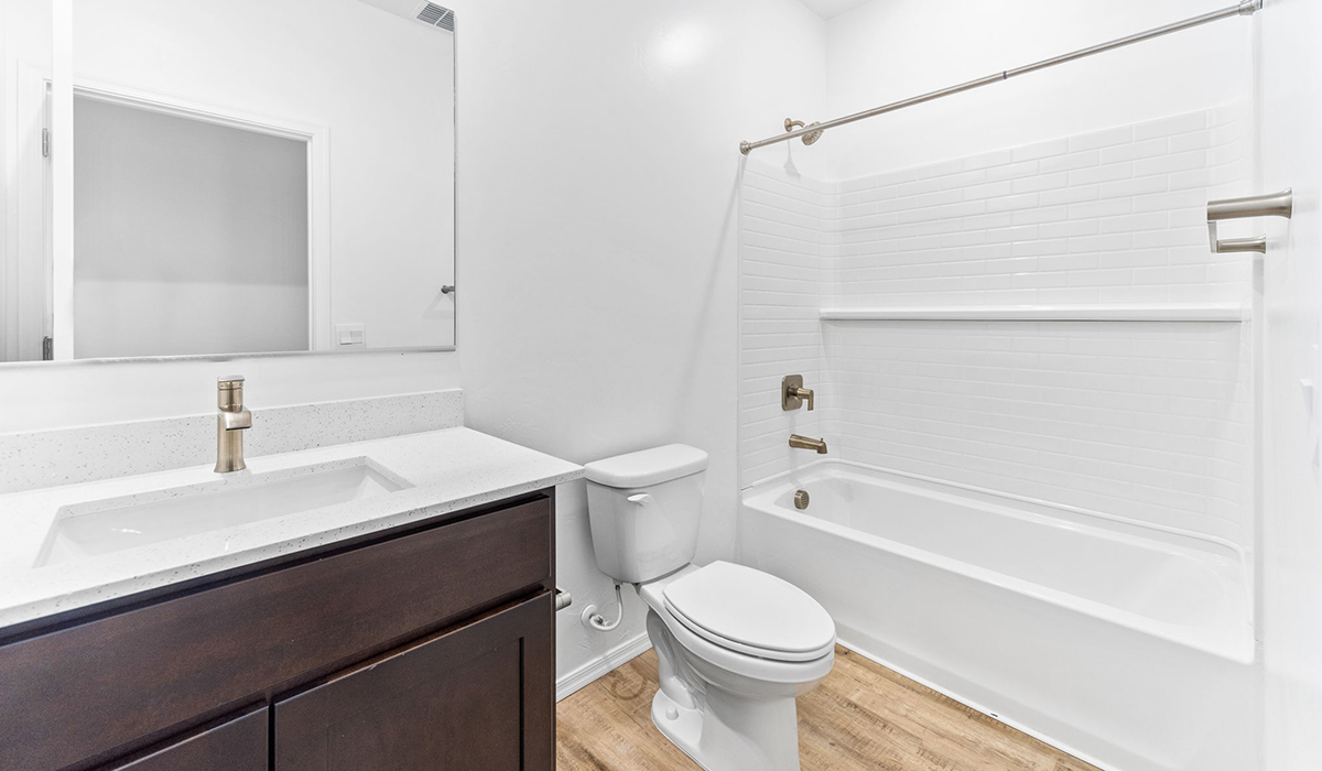 Step into The Dalea at Barnett Village, Marana, Arizona – a perfect blend of comfort, modern living, and energy efficiency. This thoughtfully crafted one-story home spans 2,224 square feet and offers five bedrooms and 3 bathrooms, ideal for families of all sizes.  The open-concept design features a spacious great room that effortlessly connects with the kitchen and dining area, creating an inviting central hub for everyday living and entertaining. The kitchen is equipped with contemporary appliances and a pantry, offering ample storage and convenience for meal preparation.  The primary bedroom, located at the rear of the home, provides a peaceful retreat with a private ensuite bathroom and a generous walk-in closet. The additional four bedrooms are positioned at the front of the house, offering versatility for use as guest rooms, a home office, or children’s bedrooms.  The Dalea floor plan offers the option of a three-car tandem garage, perfect for additional space and larger sized vehicles. Whether it’s morning coffee or evening relaxation, this outdoor space extends your living area into the serene landscape of Barnett Village.  Built with energy efficiency as a priority, the Dalea includes smart home technology, which not only simplifies daily living but also helps reduce utility costs.