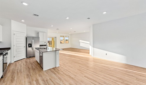 Step into The Dalea at Barnett Village, Marana, Arizona – a perfect blend of comfort, modern living, and energy efficiency. This thoughtfully crafted one-story home spans 2,224 square feet and offers five bedrooms and 3 bathrooms, ideal for families of all sizes.  The open-concept design features a spacious great room that effortlessly connects with the kitchen and dining area, creating an inviting central hub for everyday living and entertaining. The kitchen is equipped with contemporary appliances and a pantry, offering ample storage and convenience for meal preparation.  The primary bedroom, located at the rear of the home, provides a peaceful retreat with a private ensuite bathroom and a generous walk-in closet. The additional four bedrooms are positioned at the front of the house, offering versatility for use as guest rooms, a home office, or children’s bedrooms.  The Dalea floor plan offers the option of a three-car tandem garage, perfect for additional space and larger sized vehicles. Whether it’s morning coffee or evening relaxation, this outdoor space extends your living area into the serene landscape of Barnett Village.  Built with energy efficiency as a priority, the Dalea includes smart home technology, which not only simplifies daily living but also helps reduce utility costs.